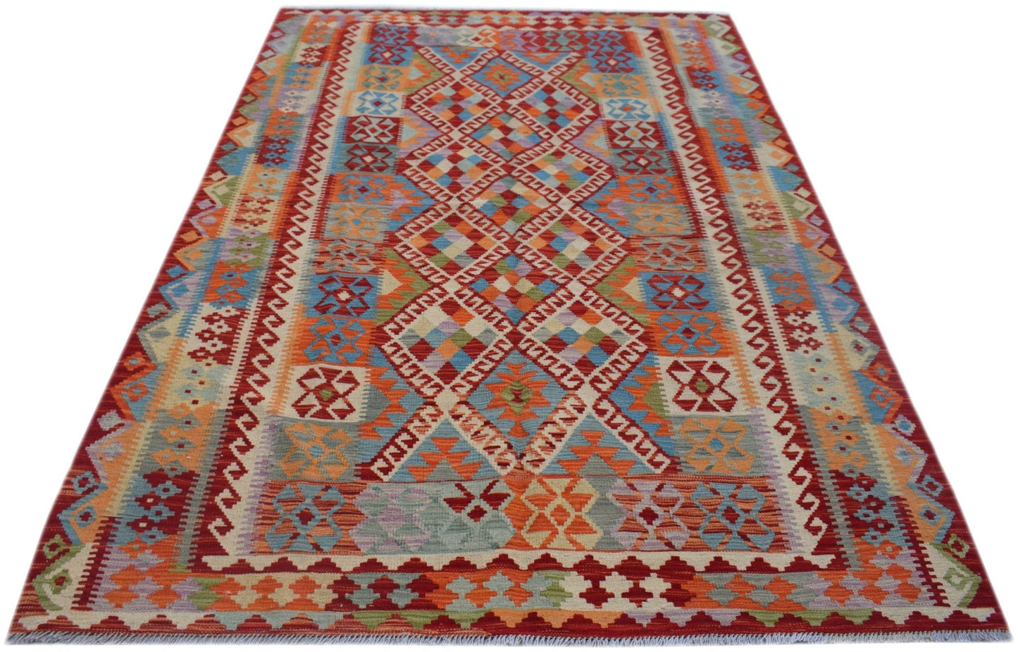 Handwoven Afghan Maimana kilim rug featuring a vibrant geometric pattern in wool.