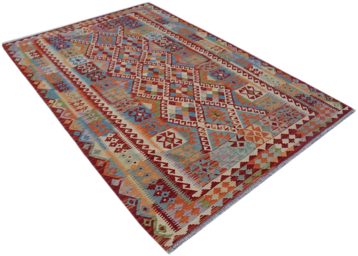 A rectangular Afghan Maimana kilim rug featuring a colorful geometric diamond pattern.