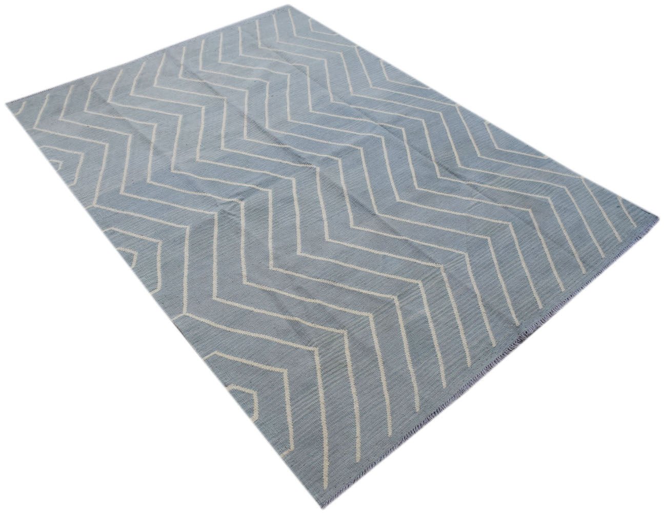 A light blue and white geometric patterned Afghan Maimana Kilim rug.