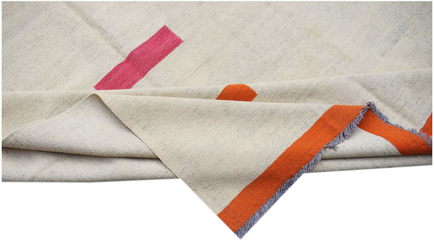 Handwoven Afghan Maimana kilim featuring a cream wool base with bold pink and orange stripes.