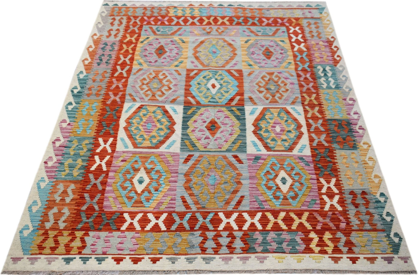 Handwoven Afghan Maimana kilim rug featuring a colorful geometric pattern on a flat wool weave.