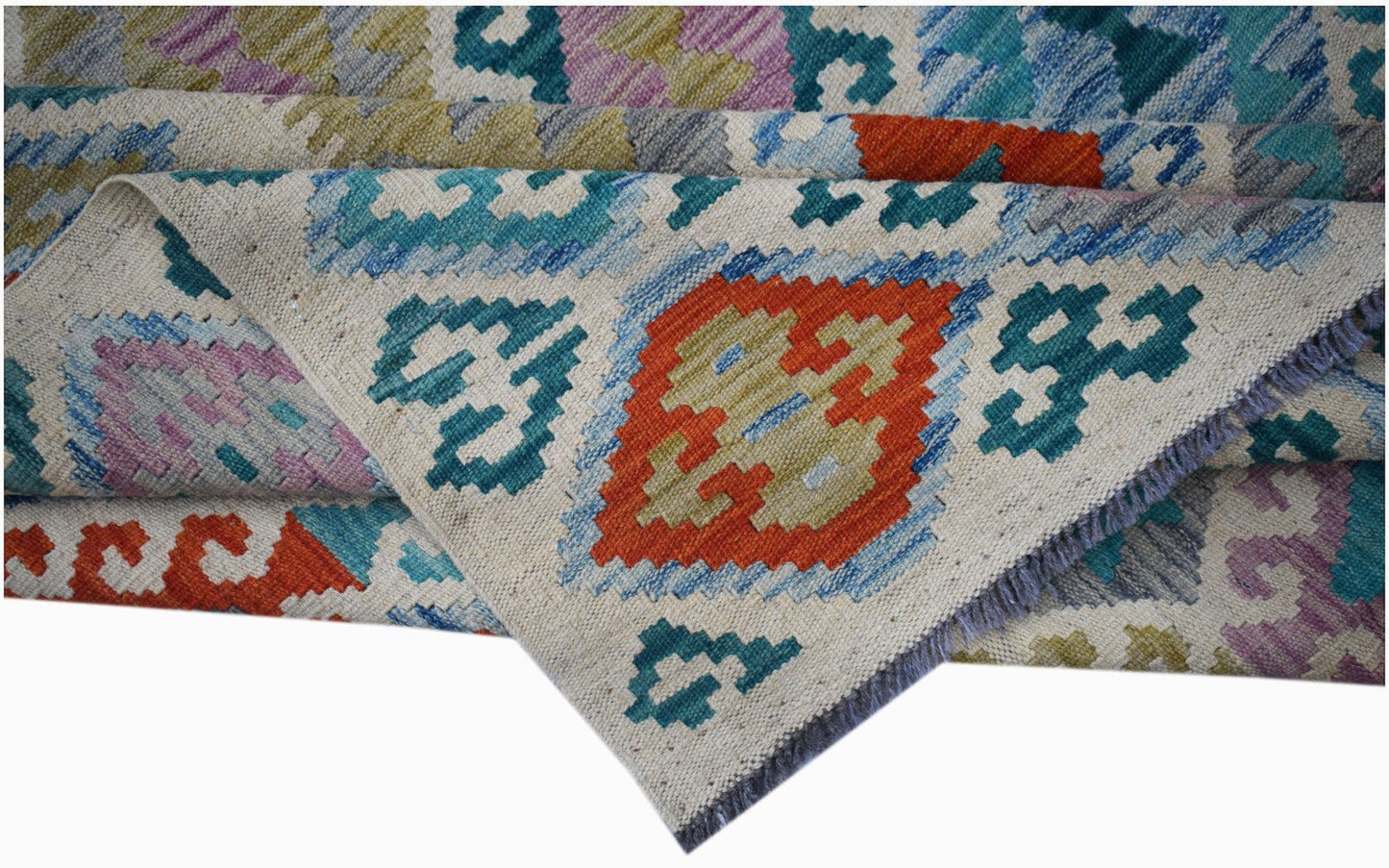 Handwoven Afghan Maimana kilim rug featuring a geometric pattern in vibrant multicolored wool.