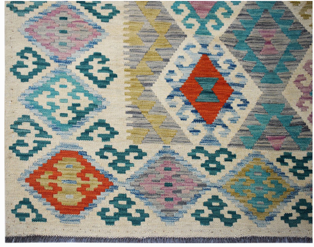 Handmade Afghan Maimana kilim rug featuring a colorful geometric diamond pattern on a cream base.