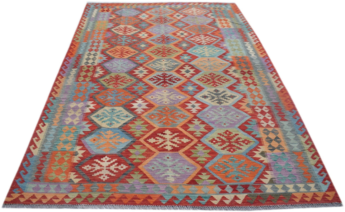 A handmade Afghan Maimana kilim rug featuring a colorful geometric diamond pattern in wool.