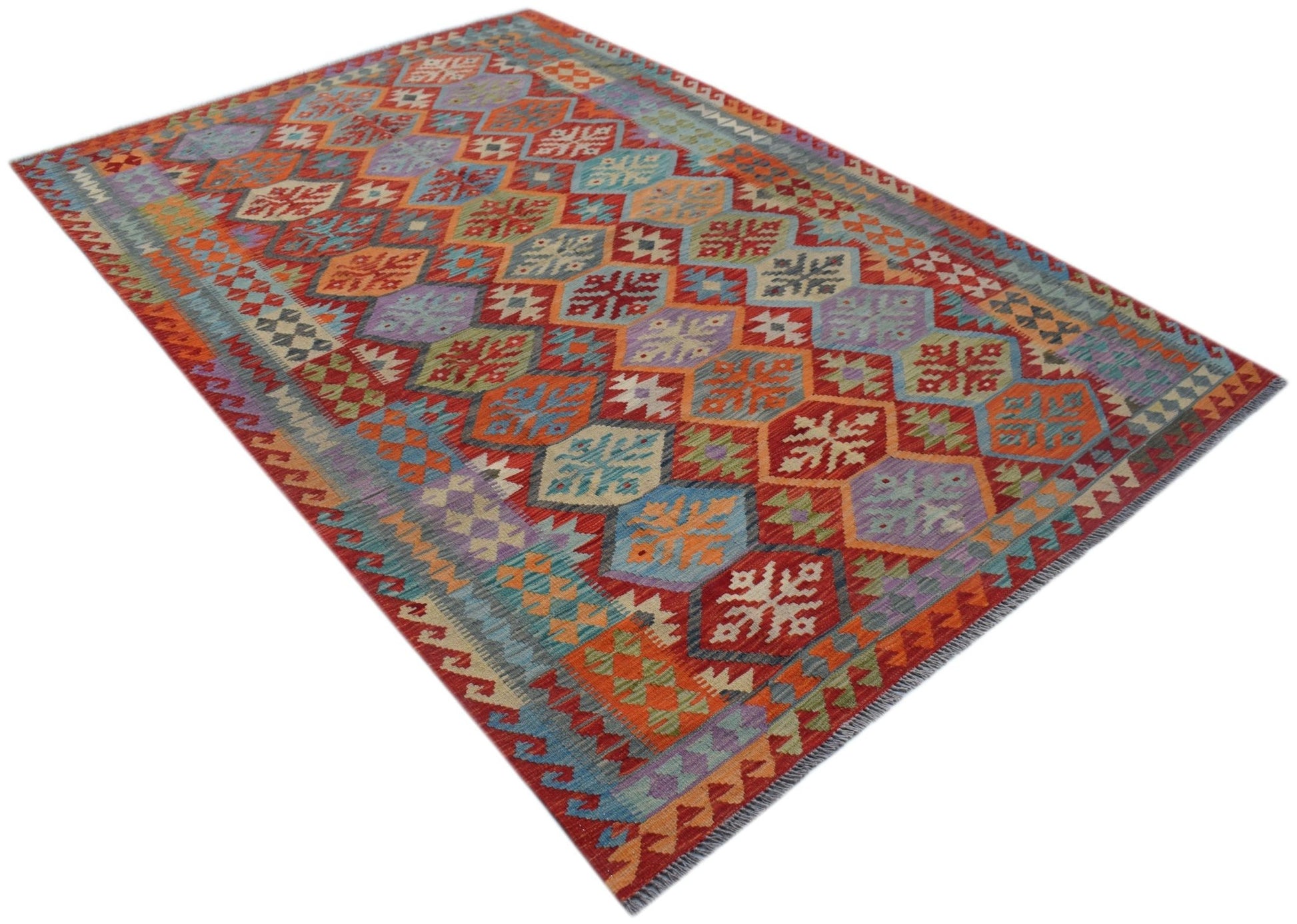 Handwoven Afghan Maimana kilim rug featuring a colorful geometric diamond pattern in wool.