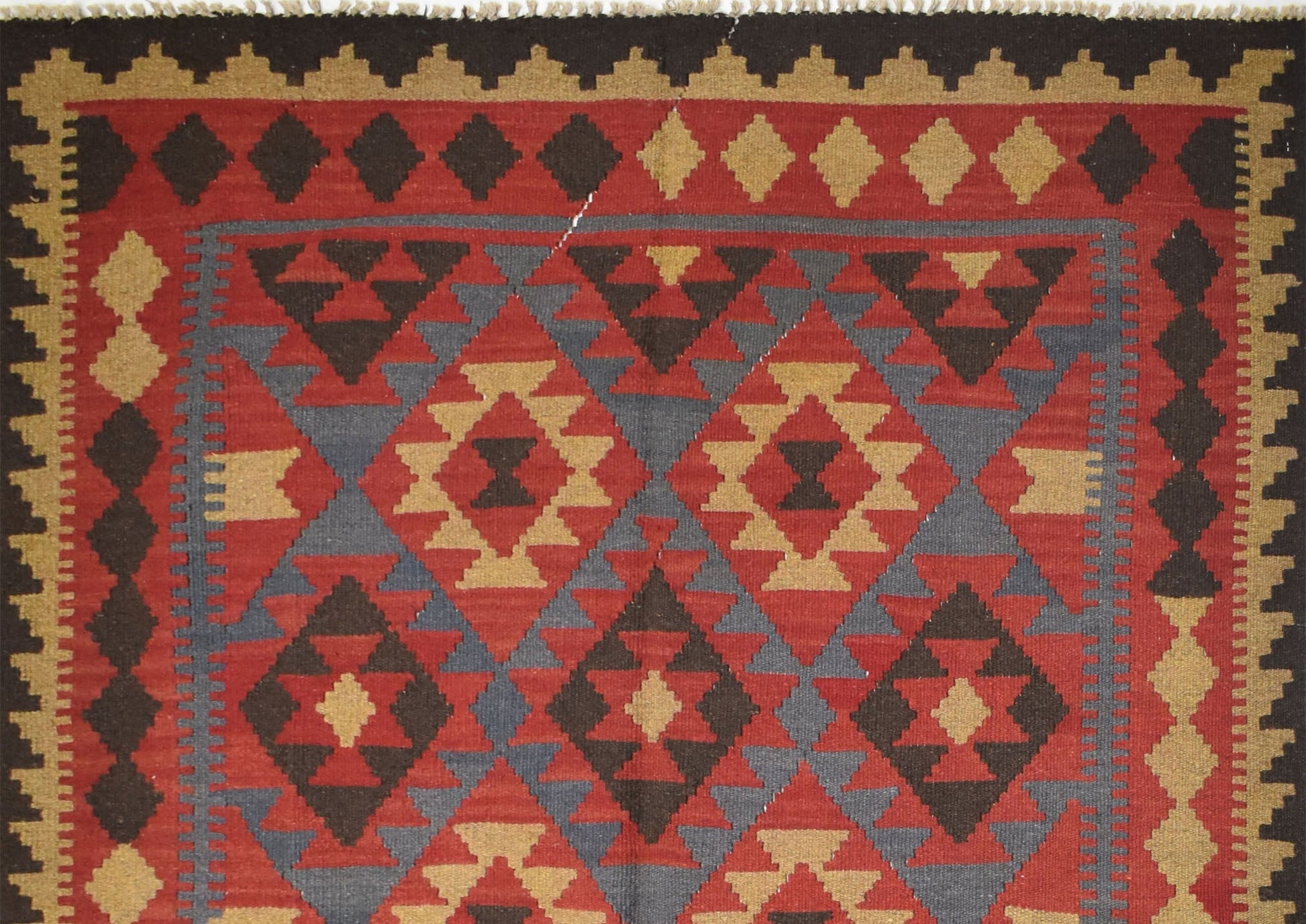 Handmade Afghan Maimana kilim rug featuring a geometric diamond pattern in red, brown, and tan.