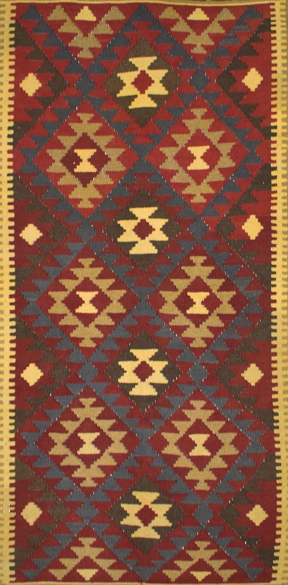 Handmade Afghan Maimana kilim rug featuring a repeating geometric diamond pattern in earthy tones.