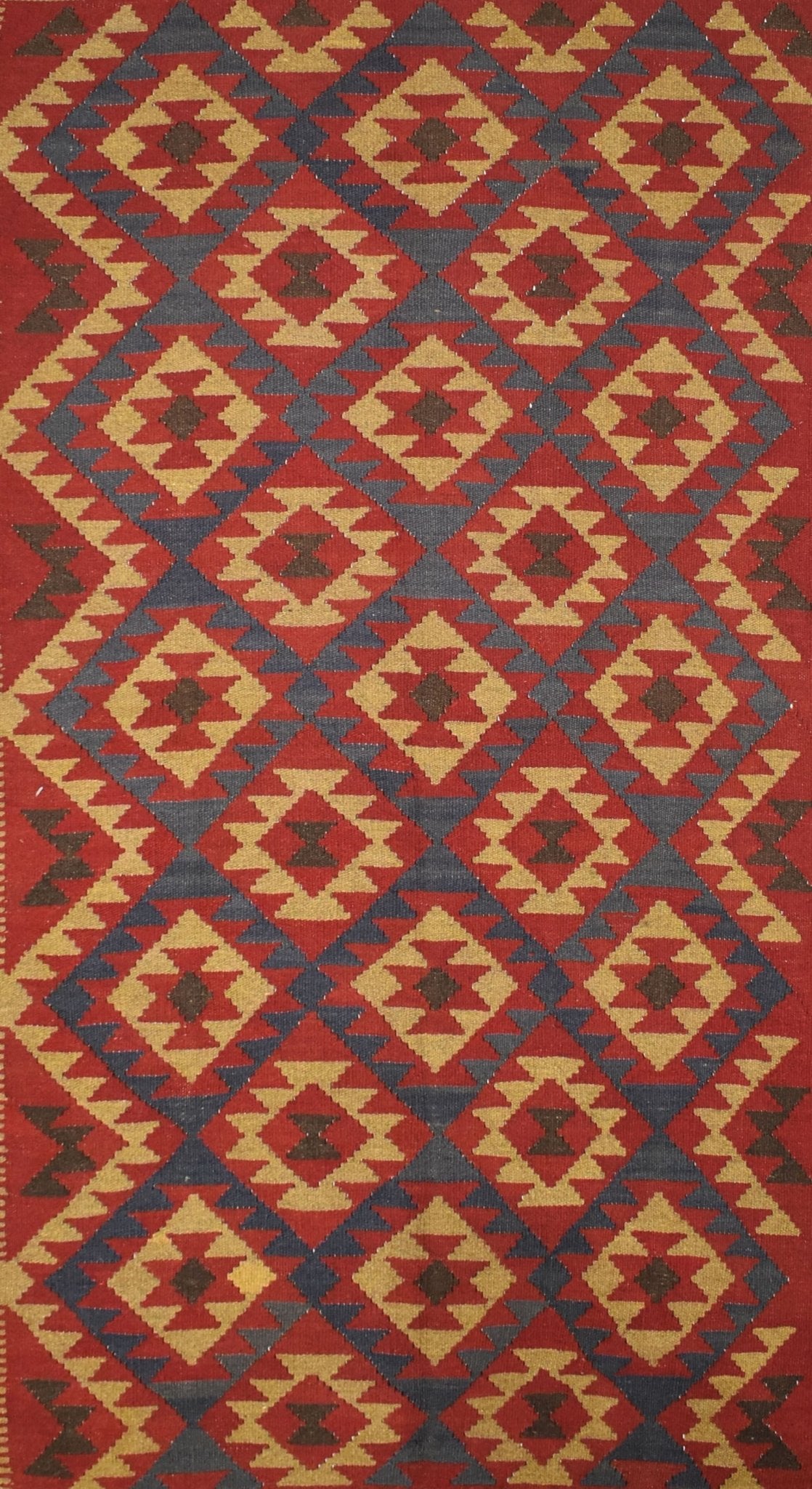 Handmade Afghan Maimana kilim rug featuring a repeating geometric diamond pattern in earthy tones.