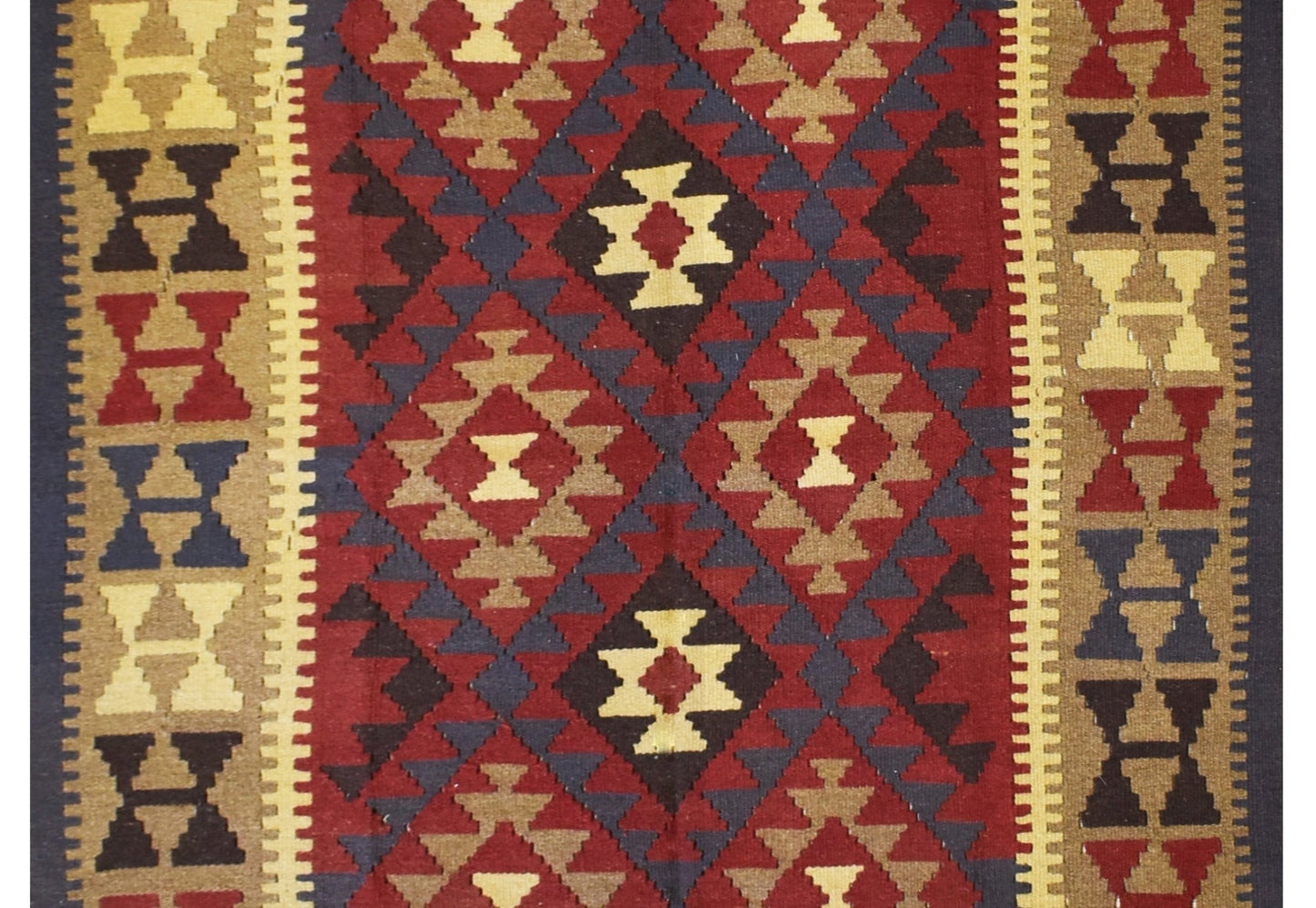 Handmade Afghan Maimana kilim rug featuring a geometric diamond pattern in red, tan, and blue.