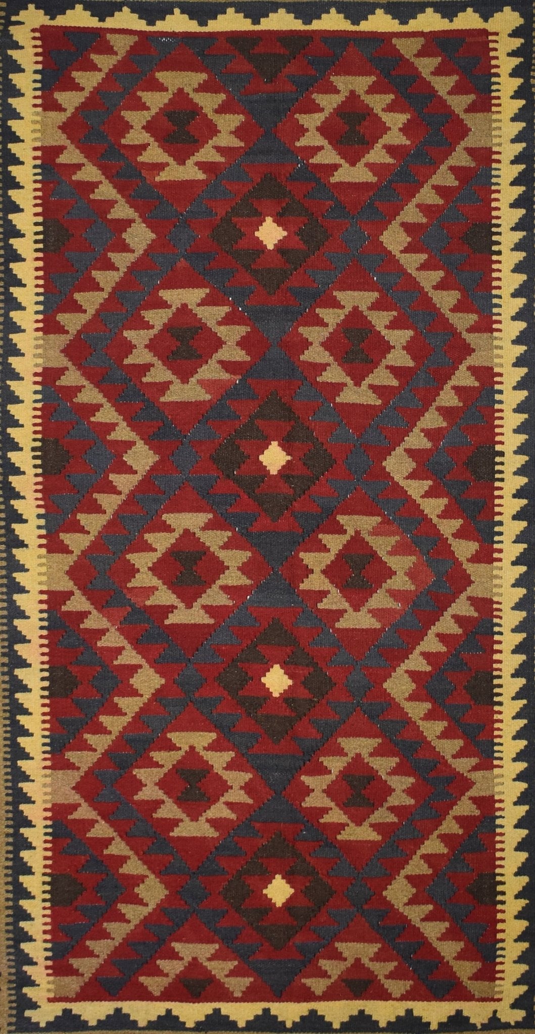Handmade Afghan Maimana kilim rug featuring a geometric diamond pattern in red, blue, and tan.