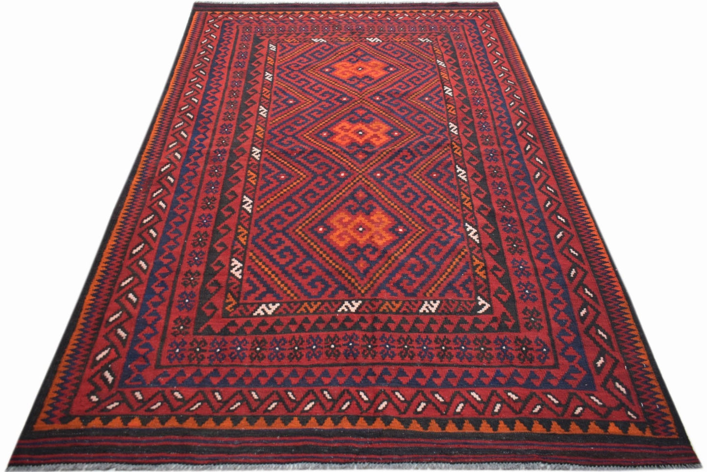Handwoven Afghan Maimana kilim rug featuring a geometric diamond pattern in red and blue wool.