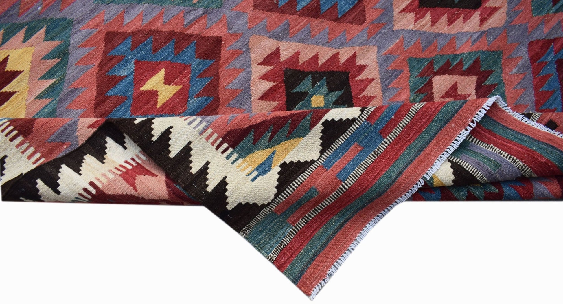 Handwoven Afghan Maimana kilim featuring a geometric pattern in vibrant red, blue, and yellow.