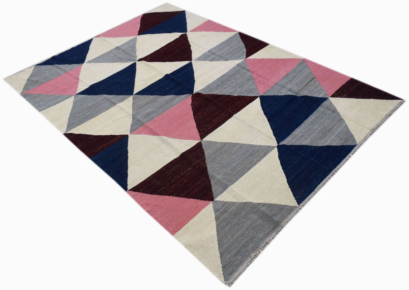 Handwoven Afghan Maimana kilim rug featuring a geometric pattern of blue, pink, grey, and maroon.