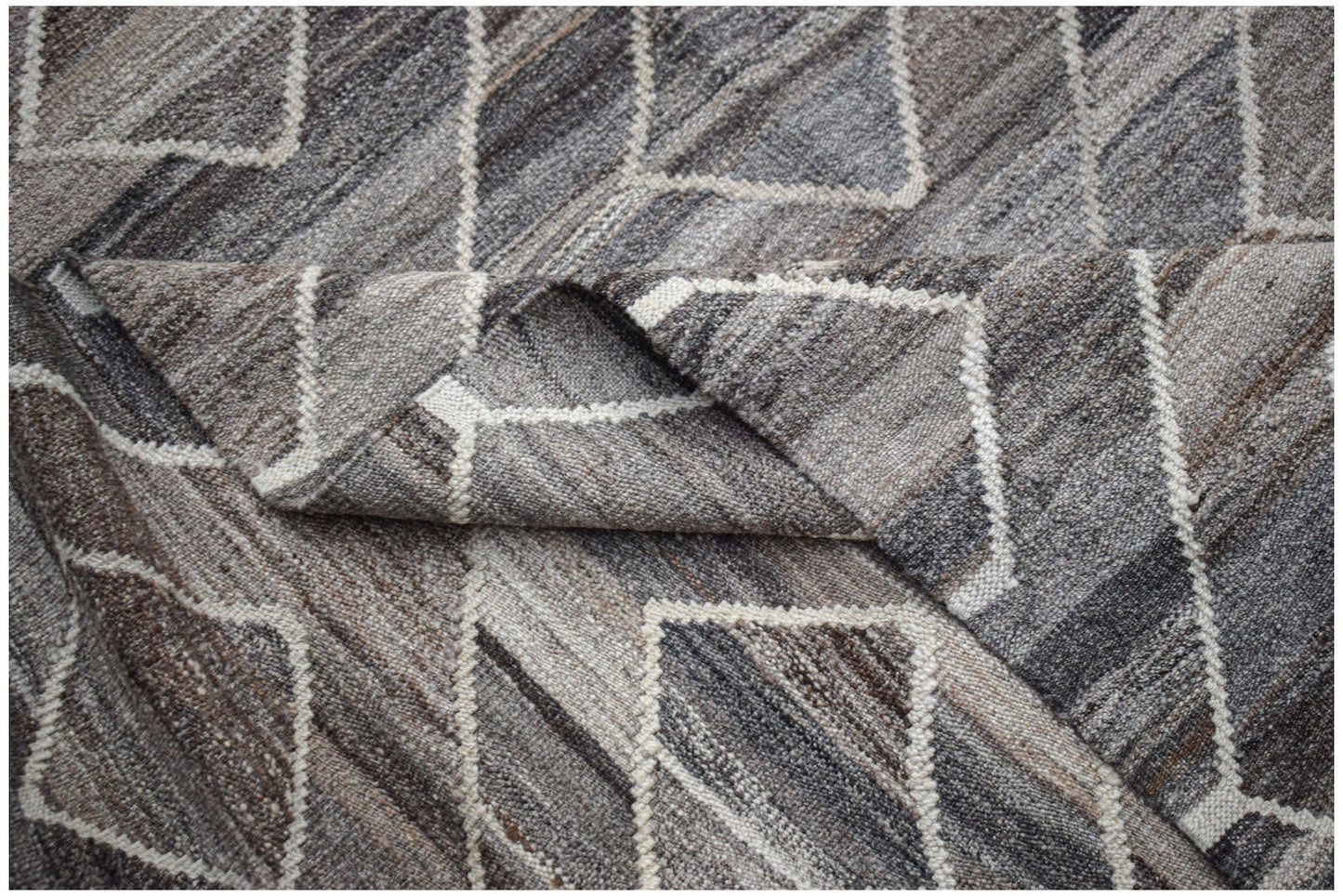 A handwoven Afghan Maimana kilim featuring a grey and brown geometric diamond pattern.