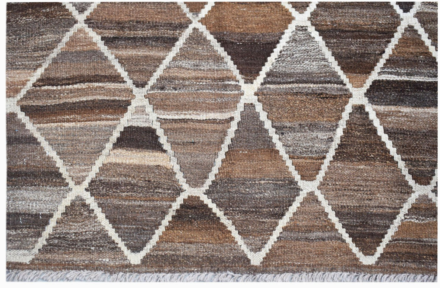 Handwoven Afghan Maimana kilim rug featuring a brown and grey geometric diamond pattern.