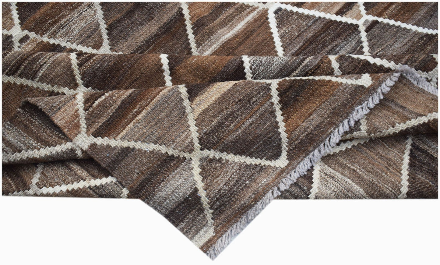 A handmade Afghan Maimana kilim rug featuring a brown and white geometric diamond pattern.