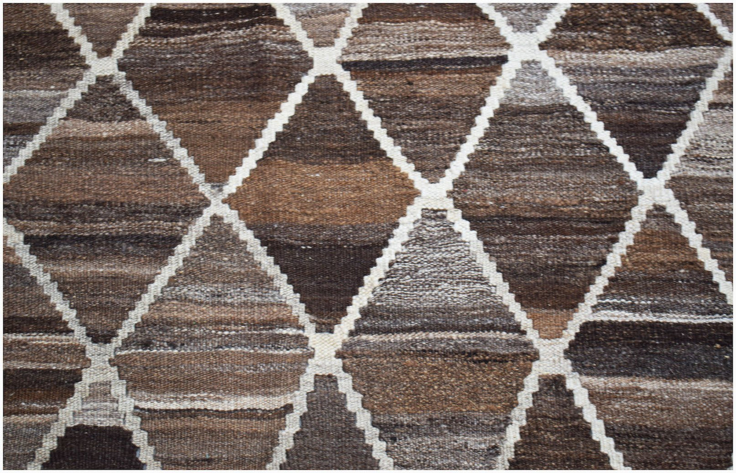 Handwoven Afghan Maimana kilim featuring a brown and cream geometric diamond pattern.