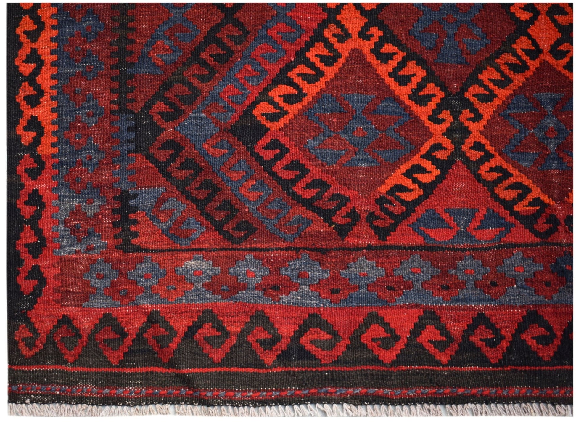 Handwoven Afghan Maimana kilim featuring a geometric diamond pattern in red, black, and blue.