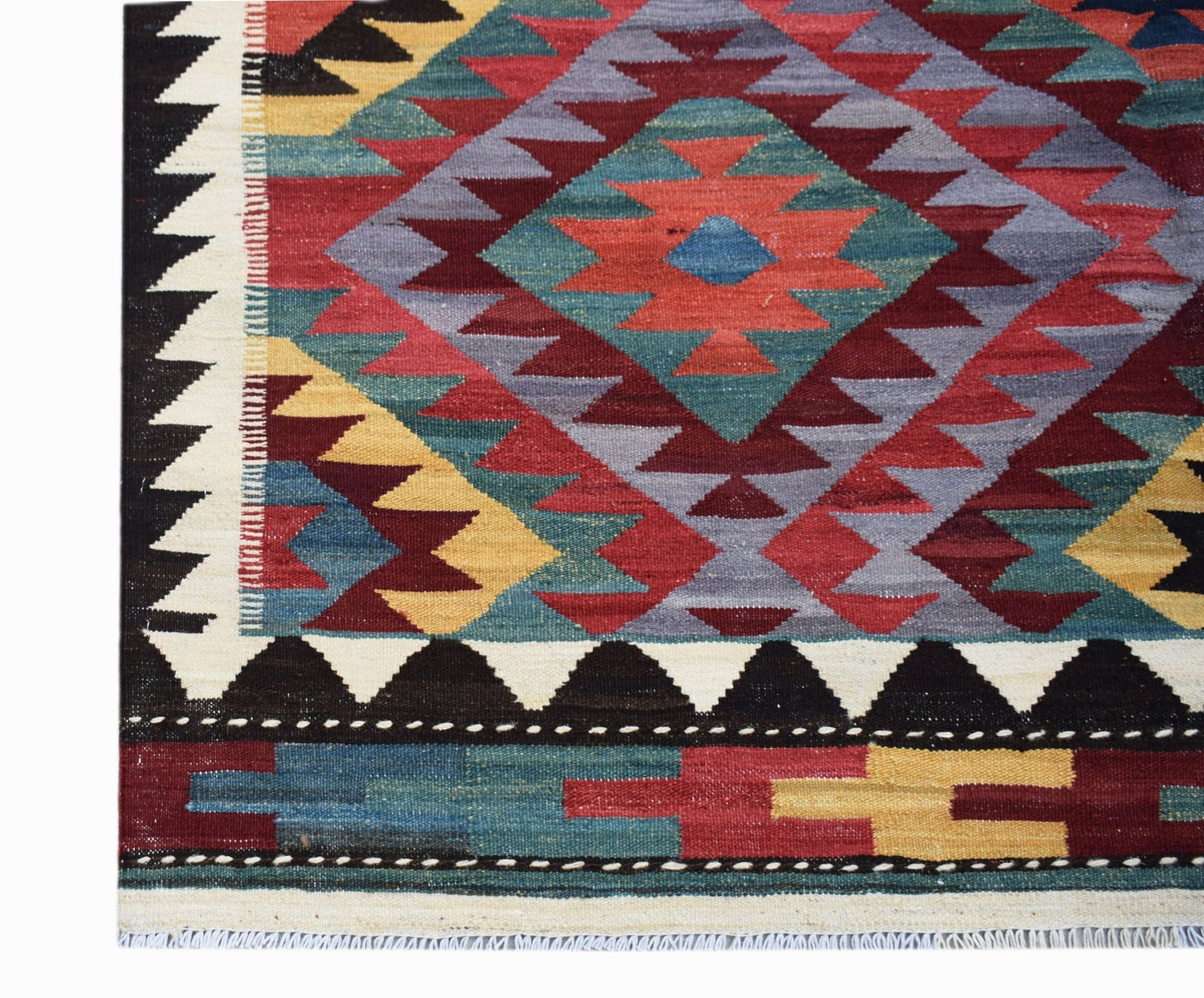 Handwoven Afghan Maimana kilim rug featuring a geometric diamond pattern in vibrant colors.
