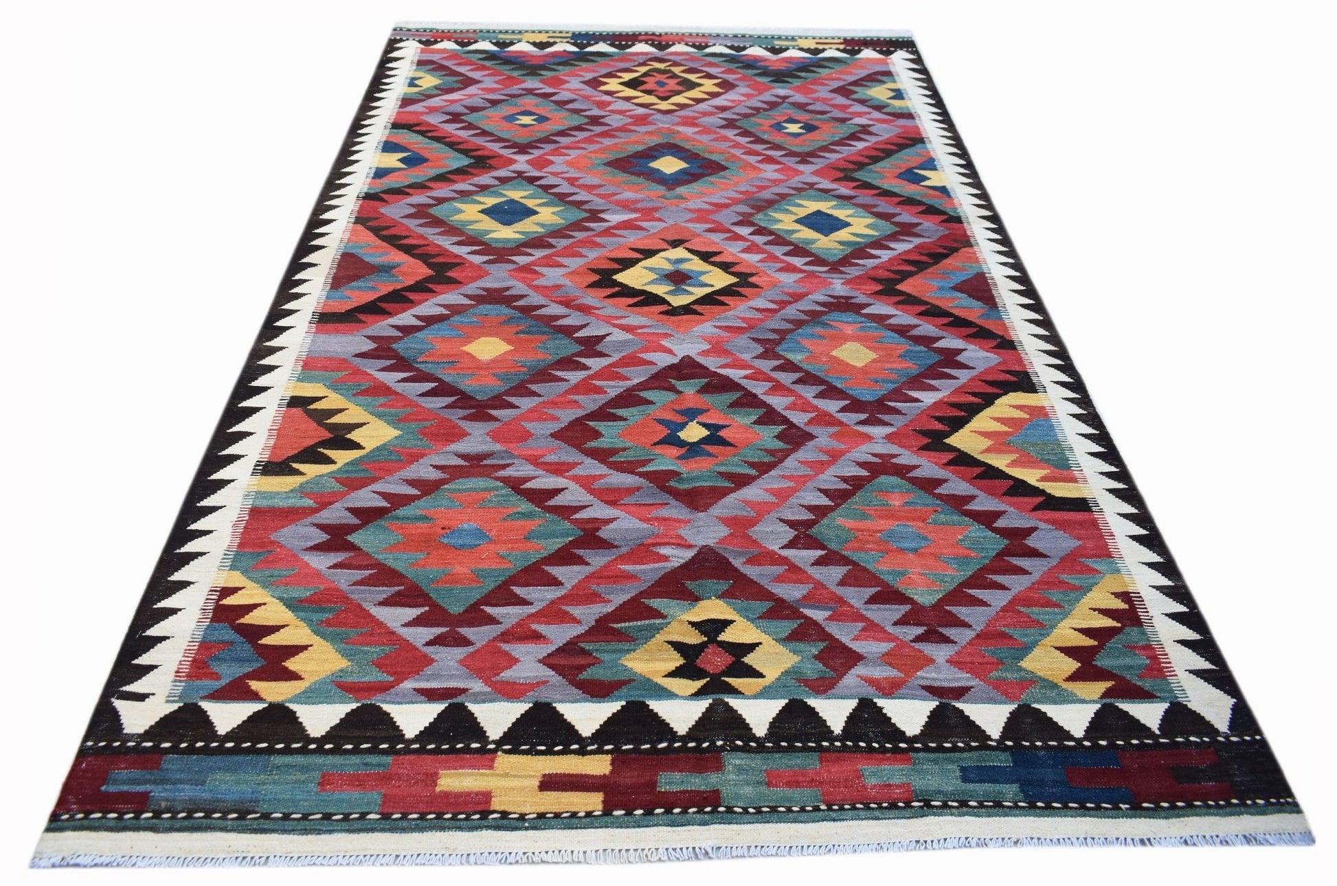 Handwoven Afghan Maimana kilim rug featuring a colorful geometric diamond pattern in wool.