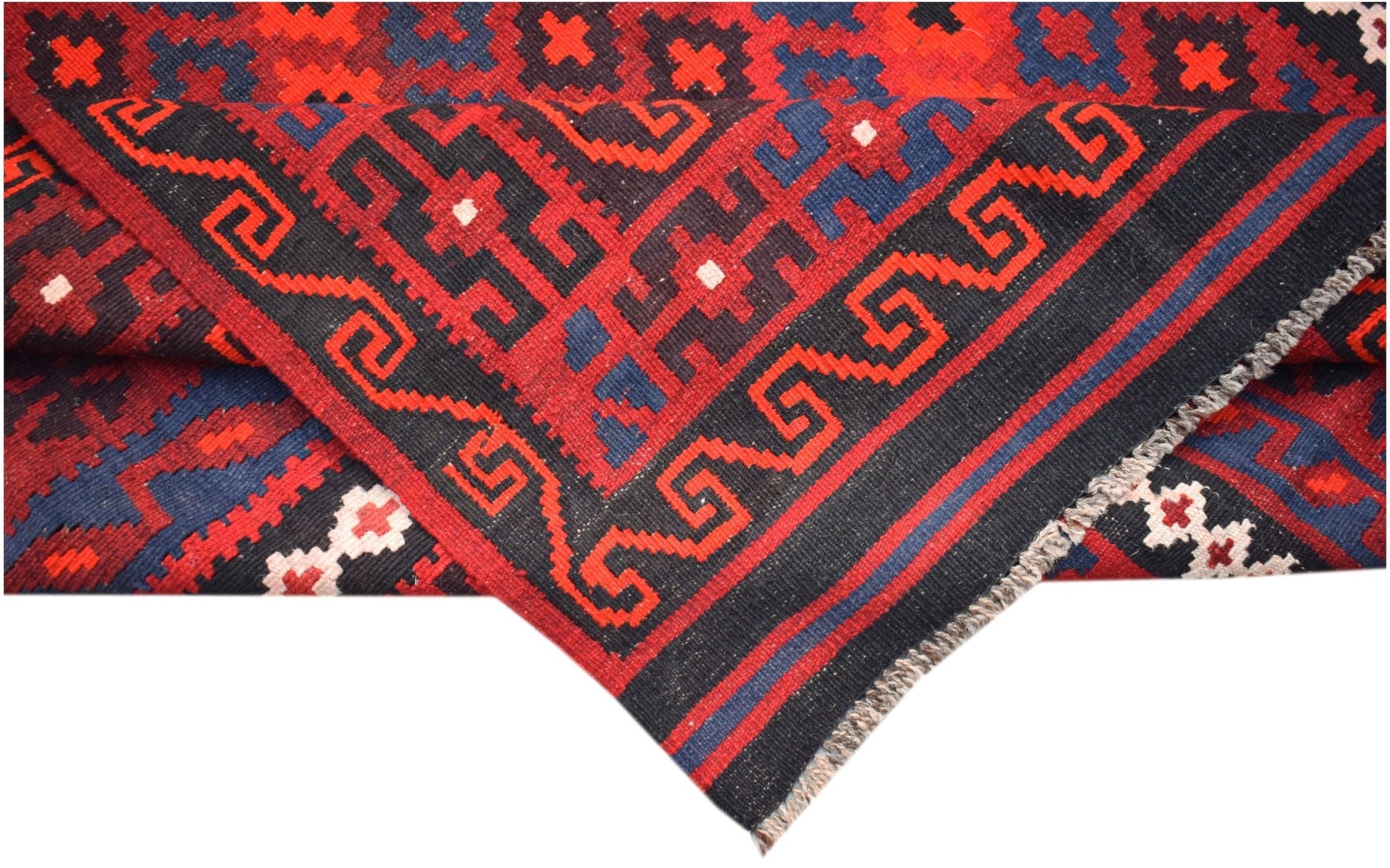 Handwoven Afghan Maimana kilim featuring a geometric pattern in red, blue, and black wool.
