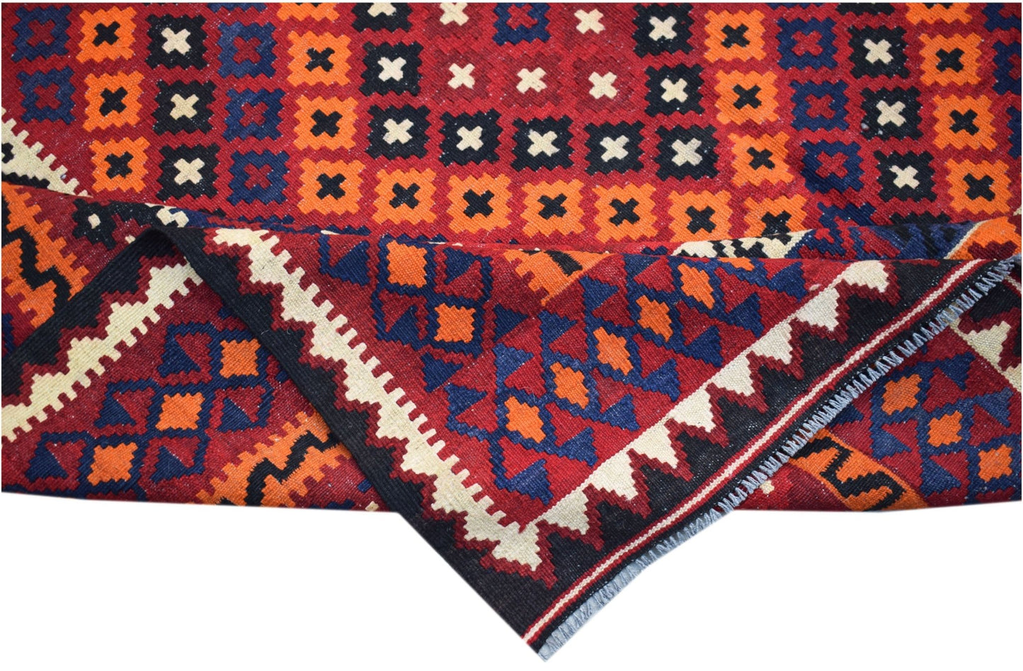 A handwoven Afghan Maimana kilim featuring a geometric pattern in red, orange, blue, and black.