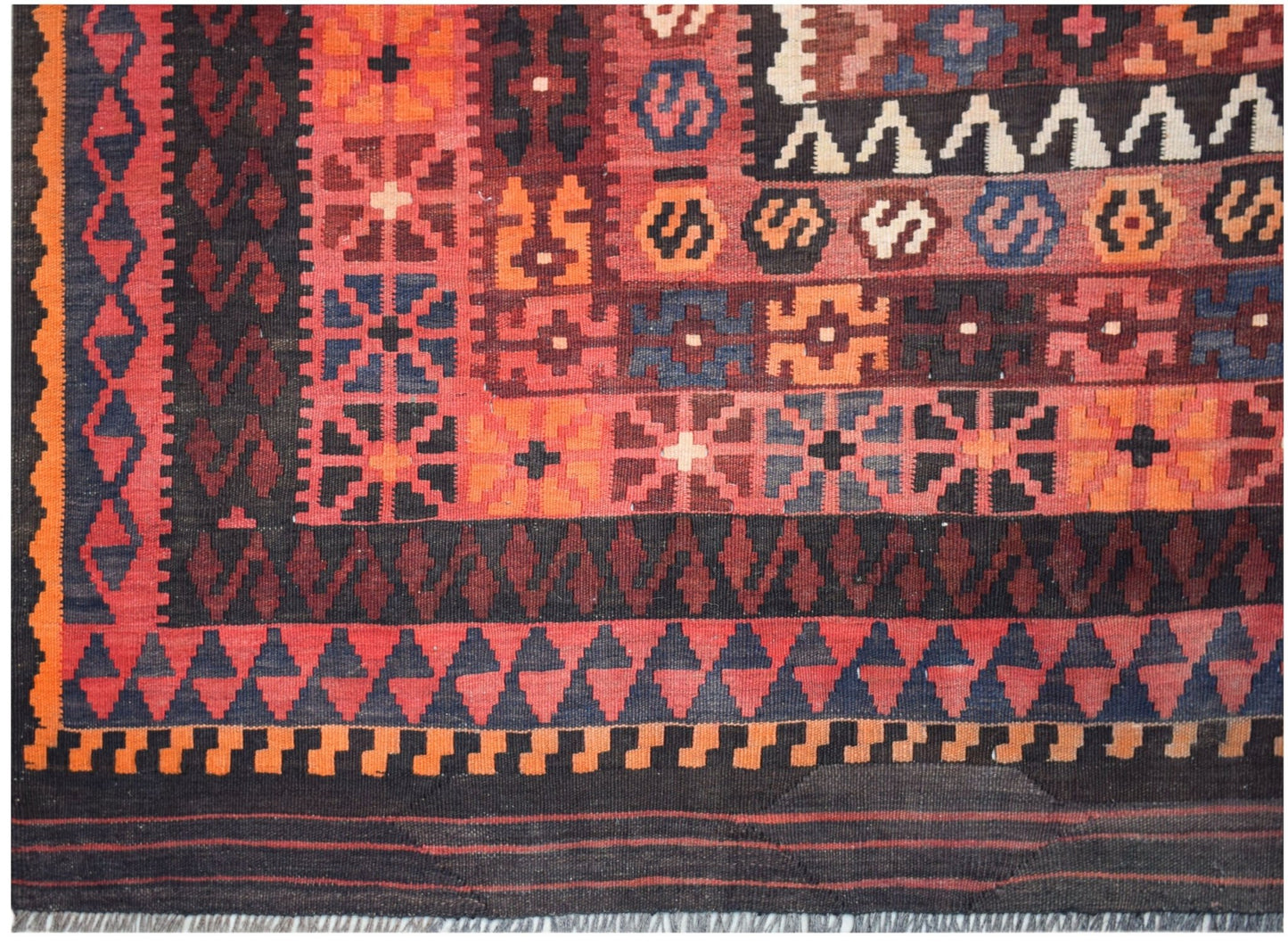 Handwoven Afghan Maimana kilim featuring a geometric pattern in red, orange, and dark blue wool.
