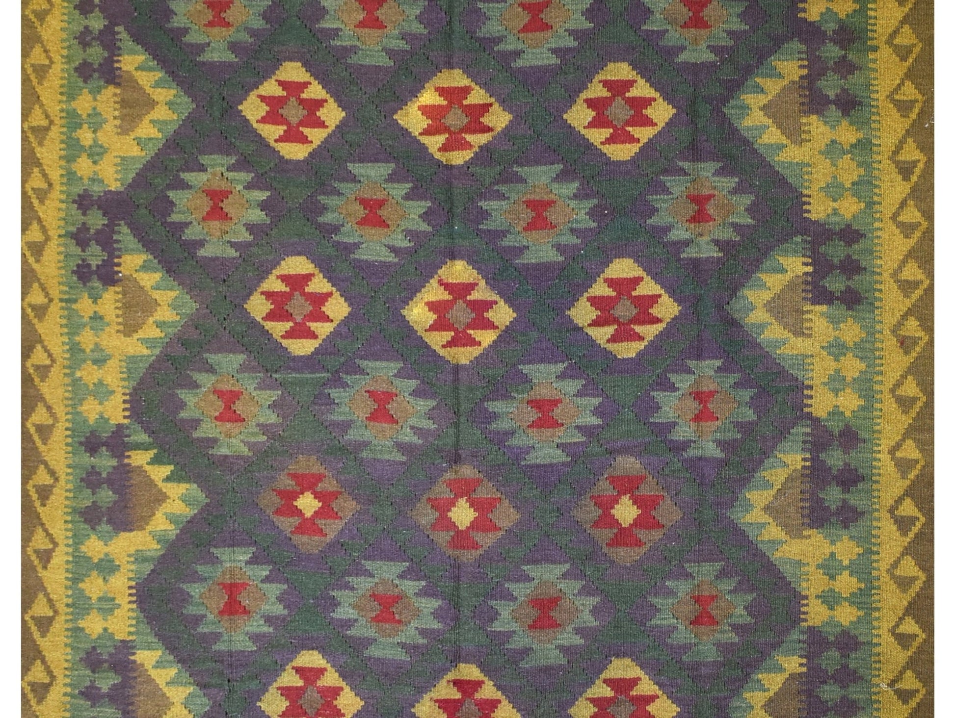 Handmade Afghan Maimana kilim rug featuring a repeating geometric diamond pattern in rich colors.