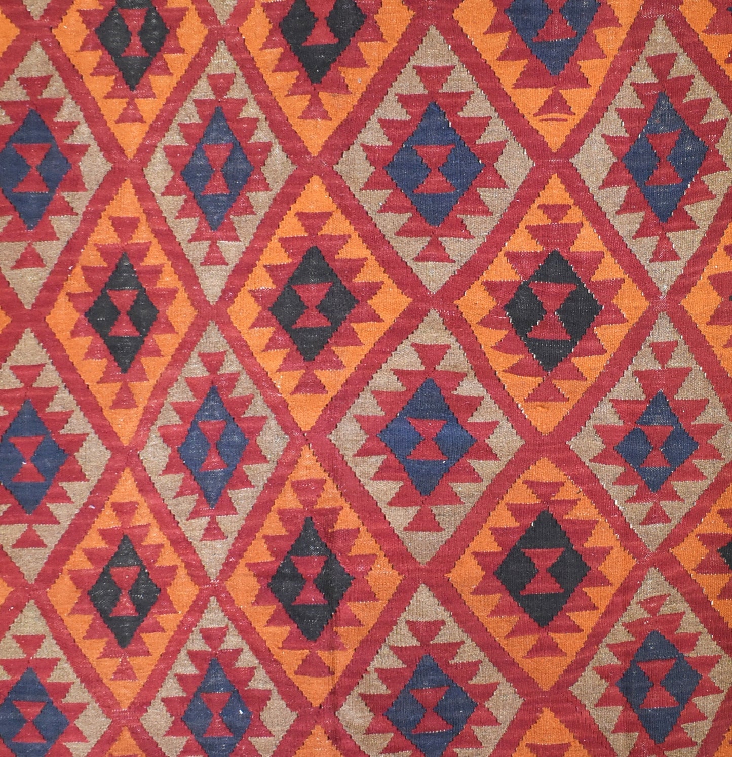 Handmade Afghan Maimana kilim rug featuring a repeating geometric diamond pattern in wool.