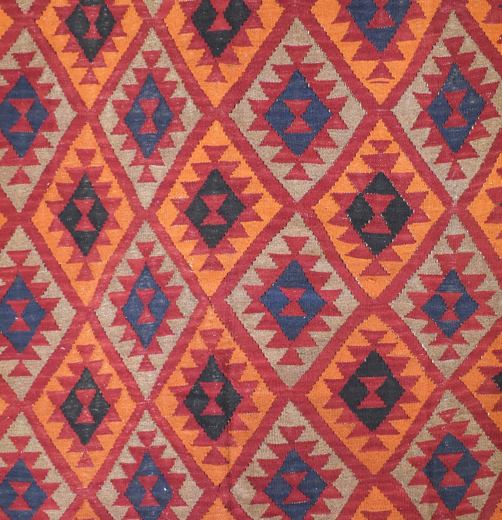 Handmade Afghan Maimana kilim rug featuring a repeating geometric diamond pattern in wool.