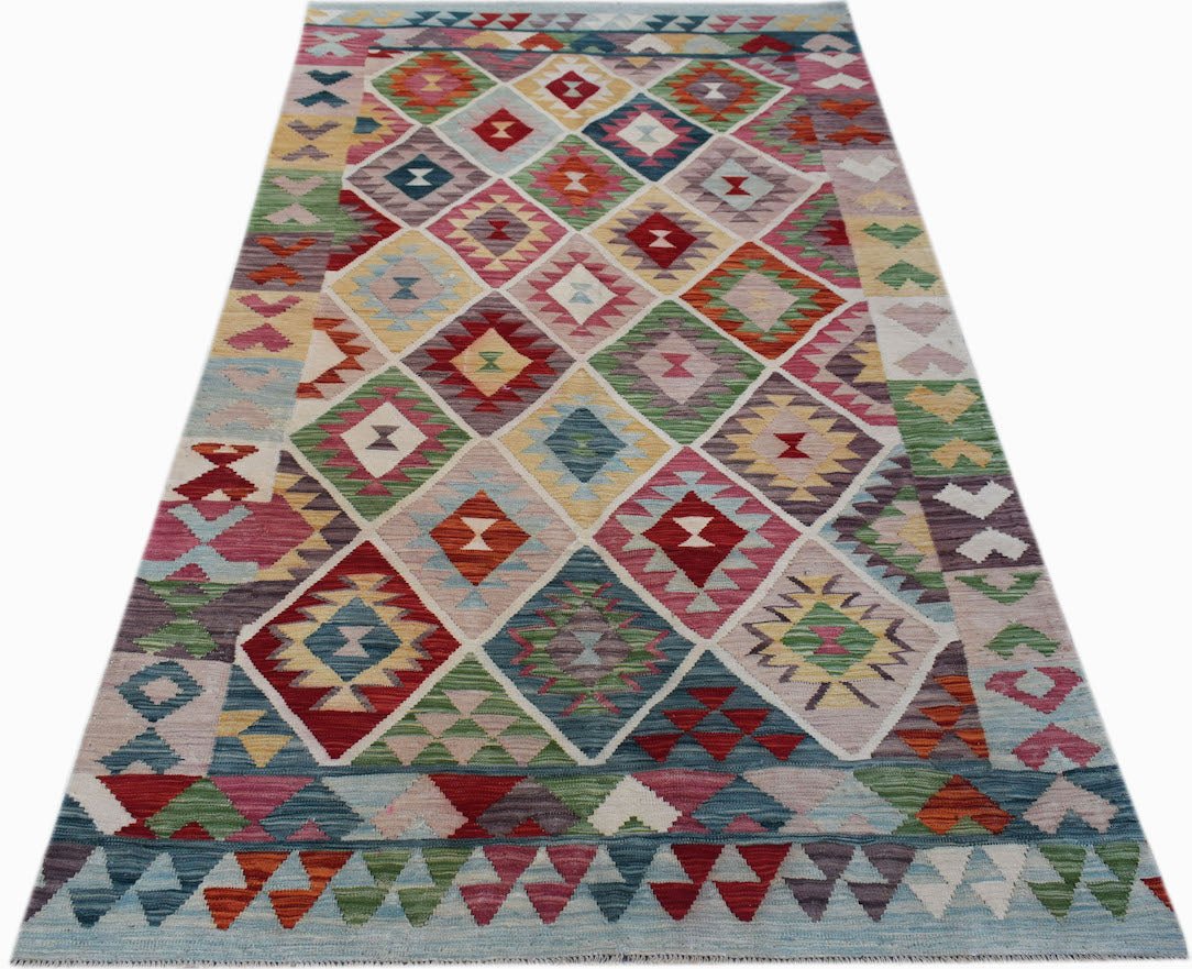 Handwoven Afghan Maimana kilim rug featuring a colorful geometric diamond pattern in wool.