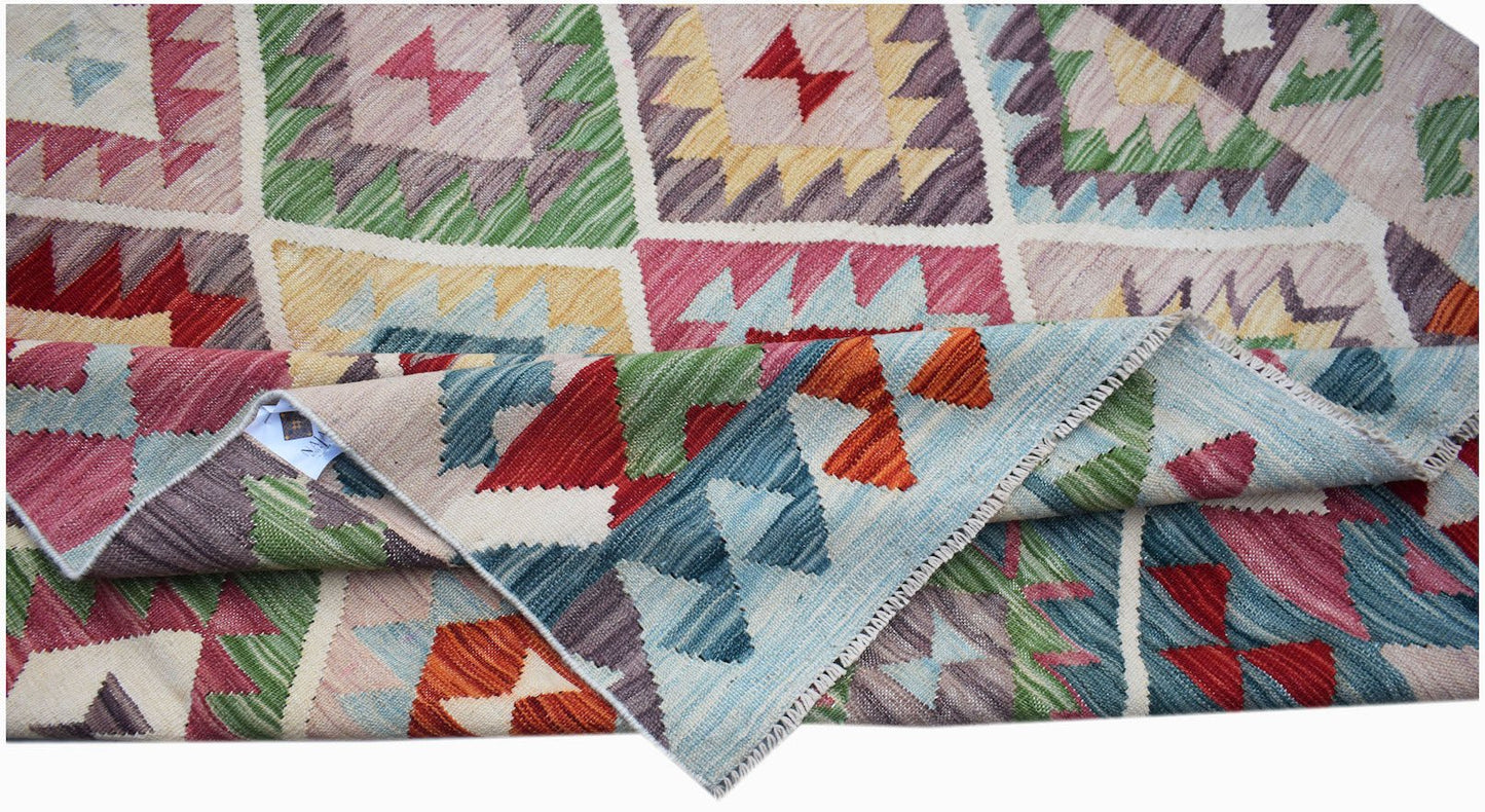 Handwoven Afghan Maimana kilim rug featuring a colorful geometric pattern and flatweave texture.