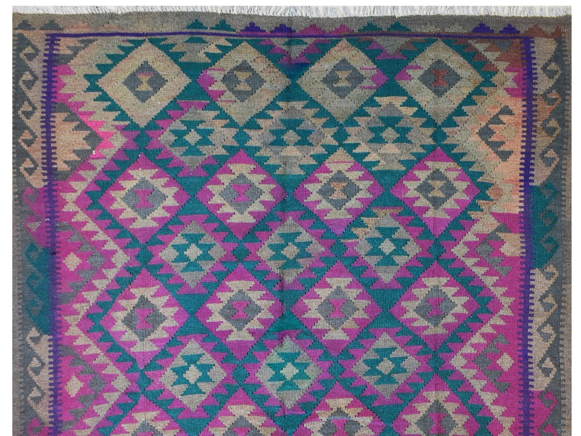 Handmade Afghan Maimana kilim rug featuring a geometric diamond pattern in teal, pink, and grey.