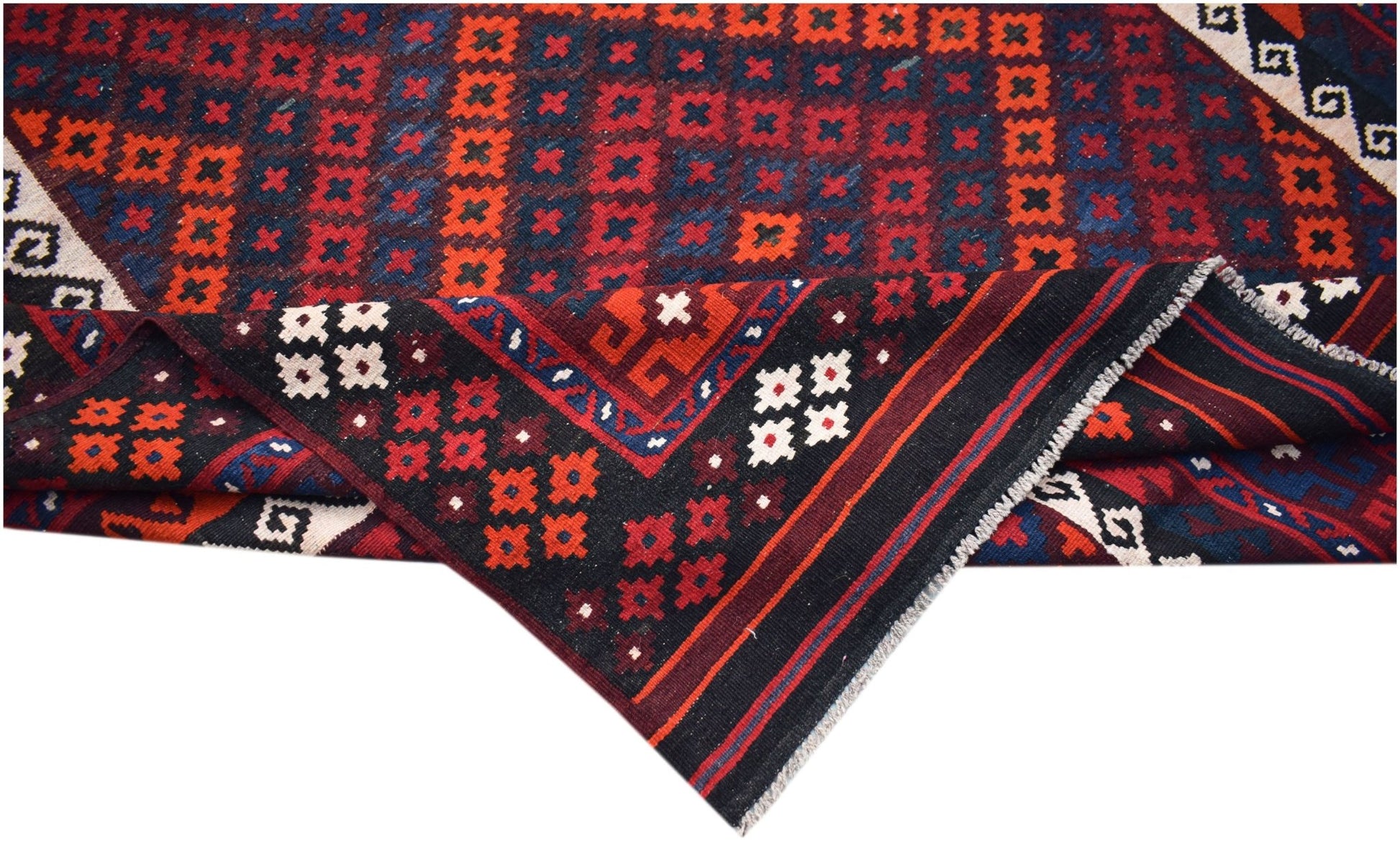 Handwoven Afghan Maimana kilim featuring geometric patterns in red, blue, and black wool.
