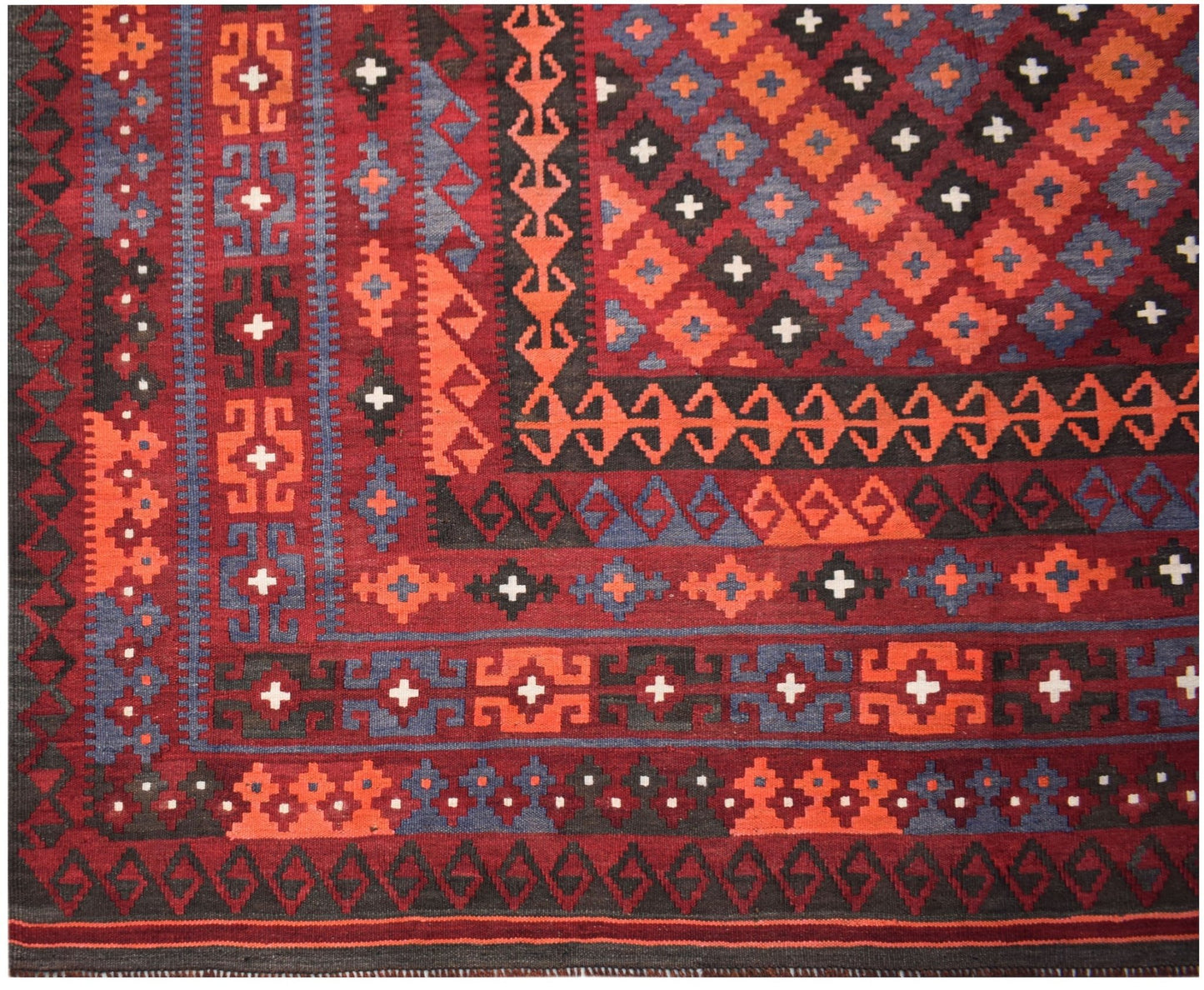 Handwoven Afghan Maimana kilim featuring a geometric diamond pattern in red, blue, and black wool.