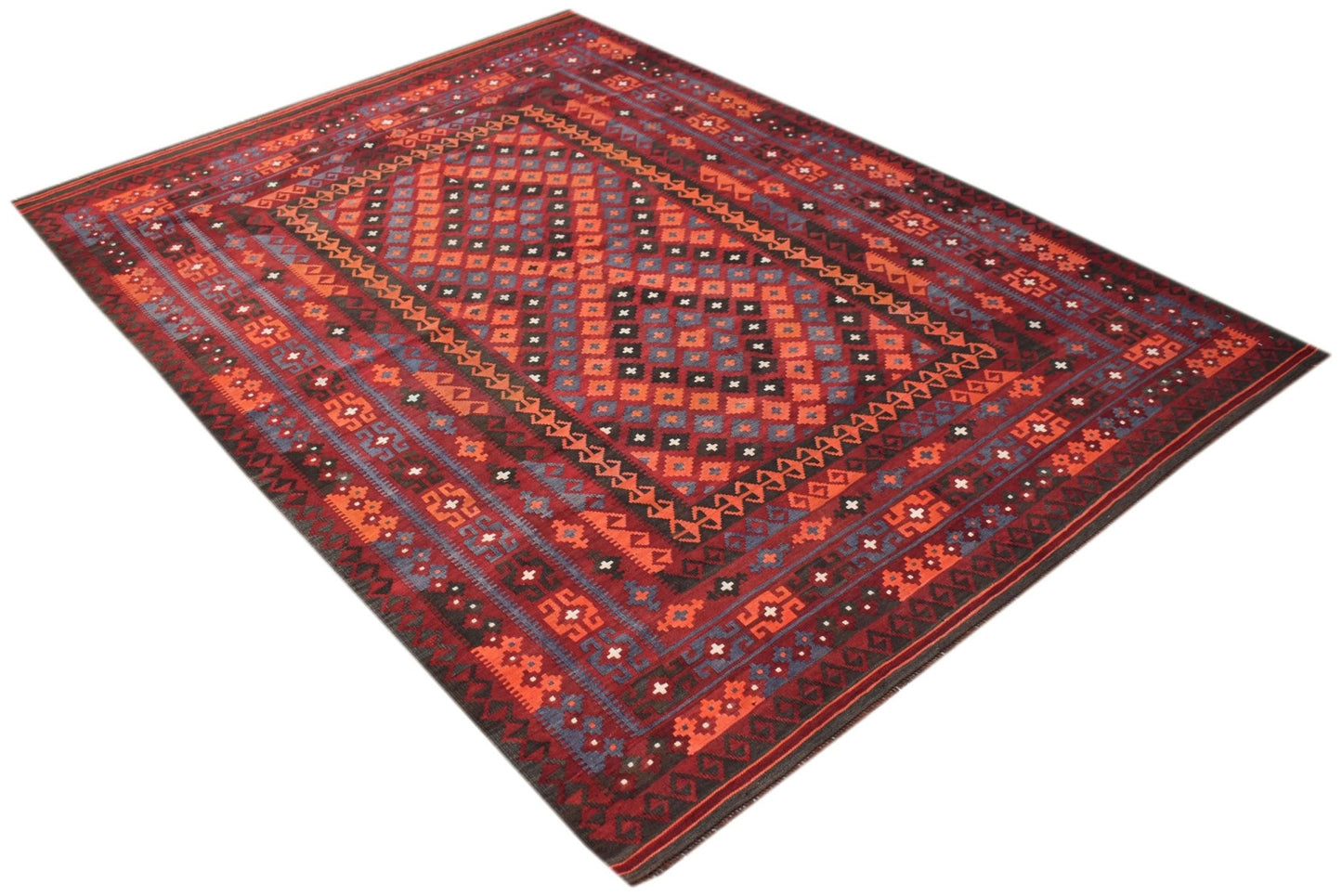 A rectangular, handwoven Afghan Maimana kilim featuring a geometric pattern in red, blue, and black.