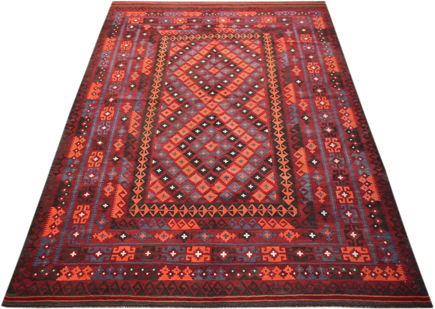 Handwoven Afghan Maimana kilim rug featuring a geometric diamond pattern in red and blue tones.