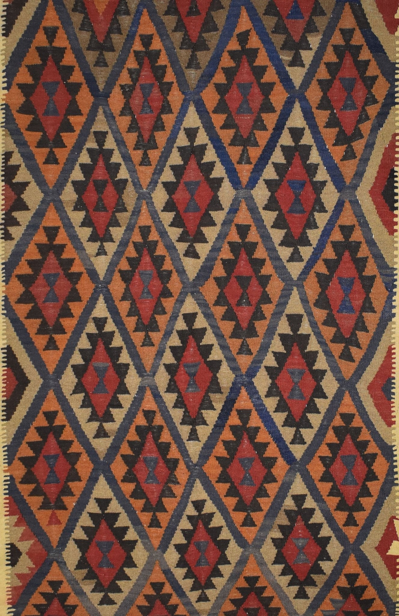 Handmade Afghan Maimana kilim rug featuring a repeating diamond pattern in red, blue, and tan.
