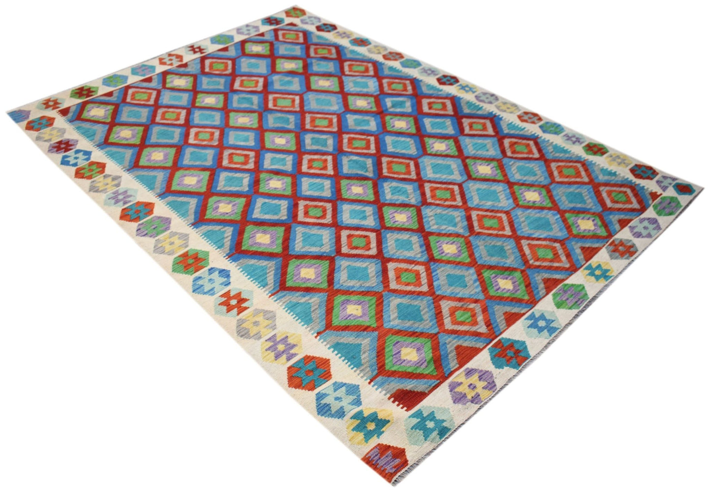 Handwoven Afghan Maimana kilim rug featuring a vibrant geometric diamond pattern in wool.