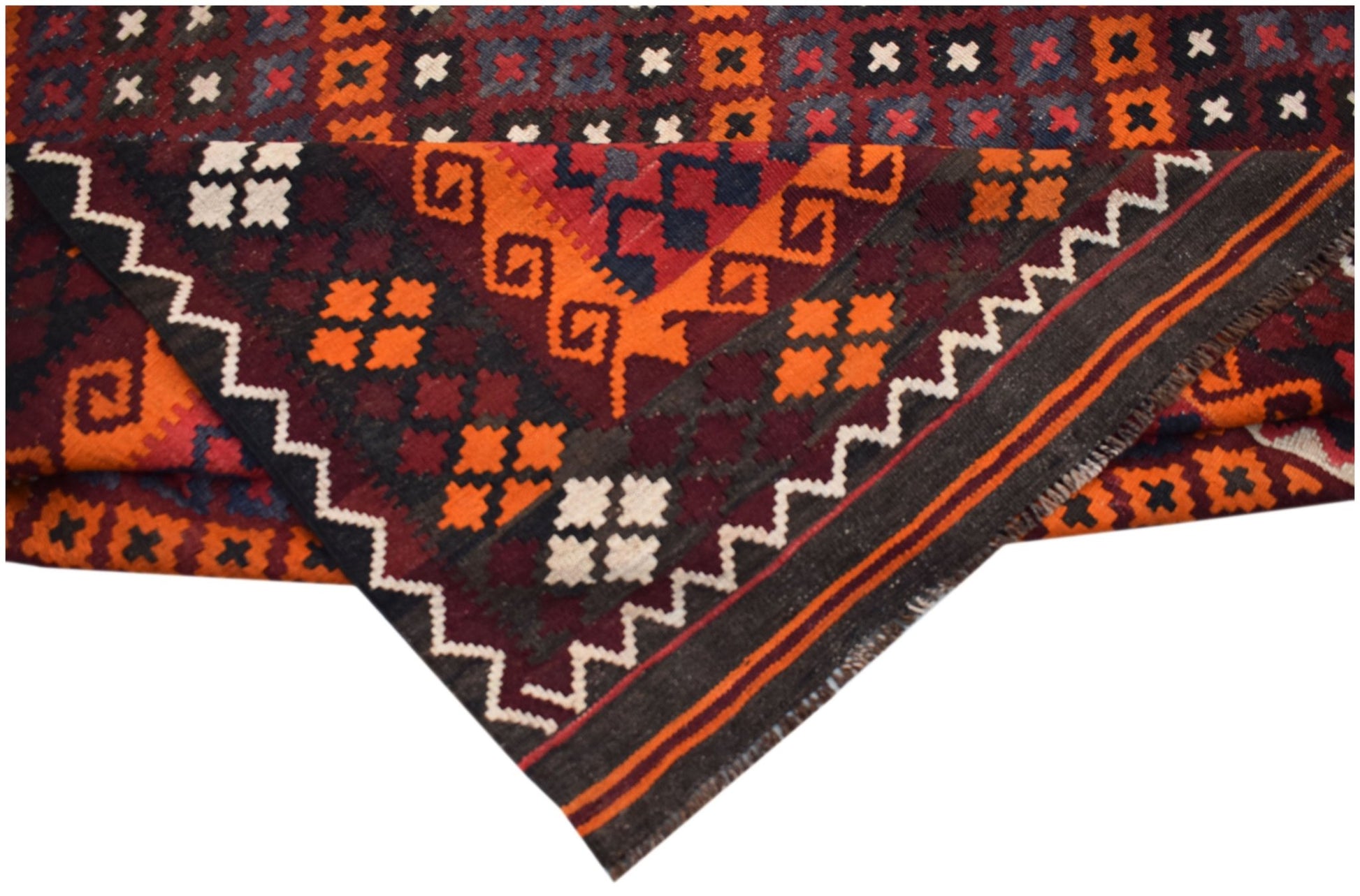 A handwoven Afghan Maimana kilim featuring geometric patterns in orange, red, and dark blue wool.