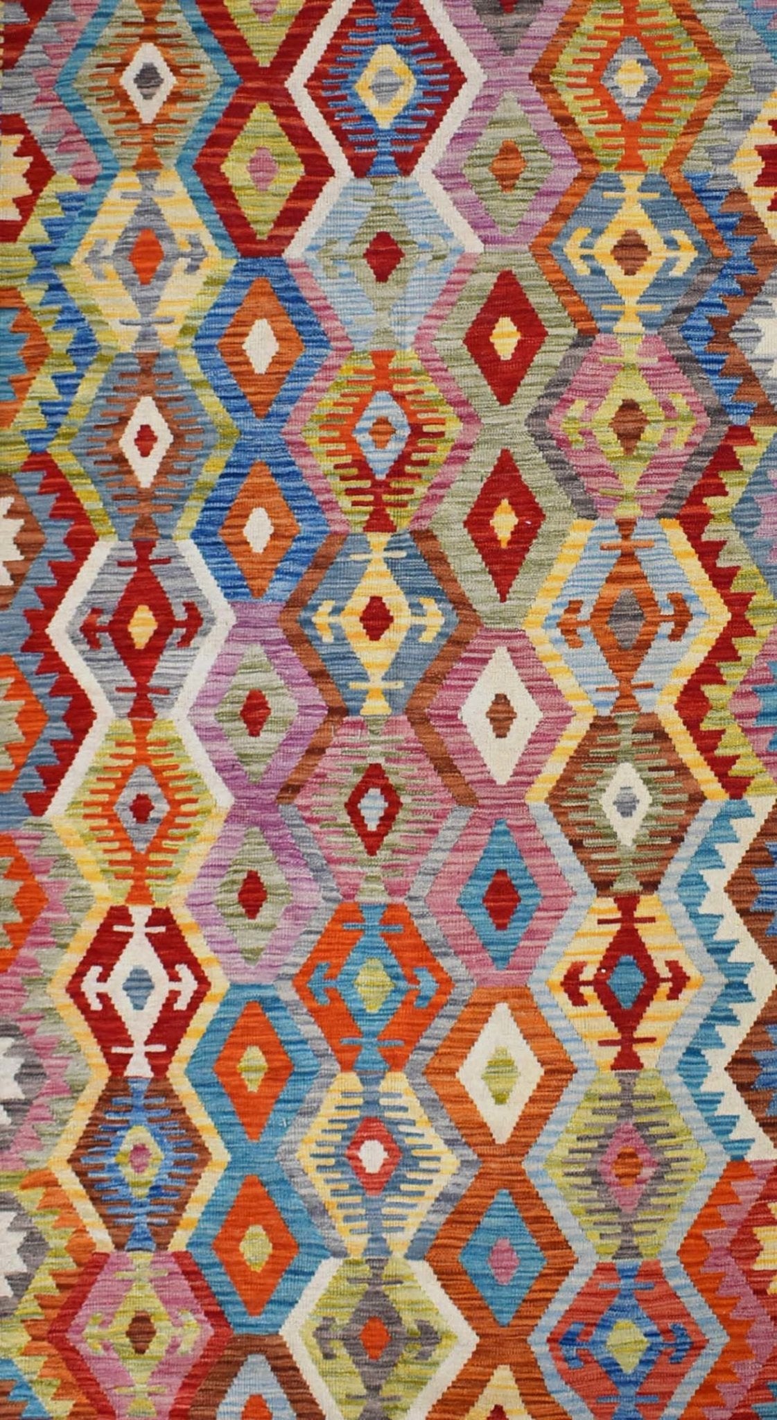 Handmade Afghan Maimana kilim rug featuring a vibrant, multicolored geometric diamond pattern.