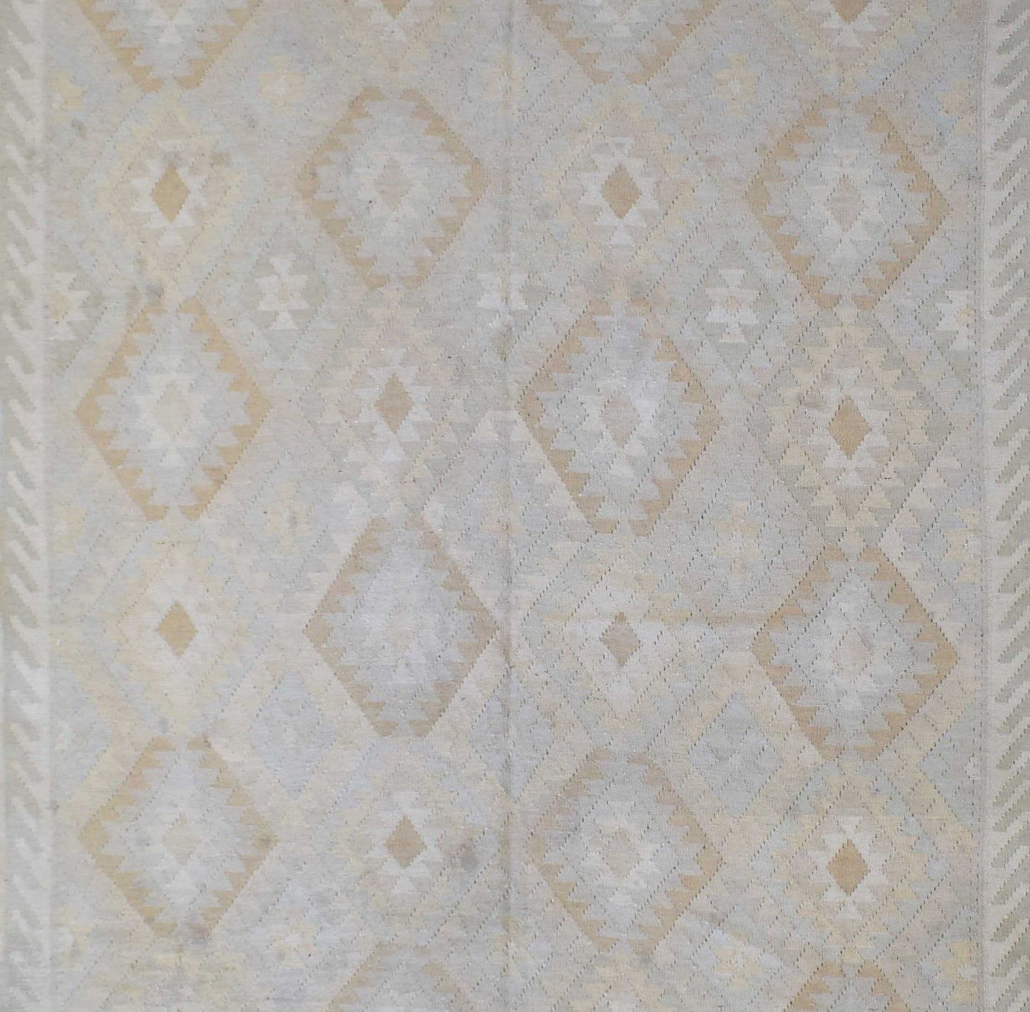 Handmade Afghan Maimana kilim rug featuring a geometric diamond pattern in neutral tones.
