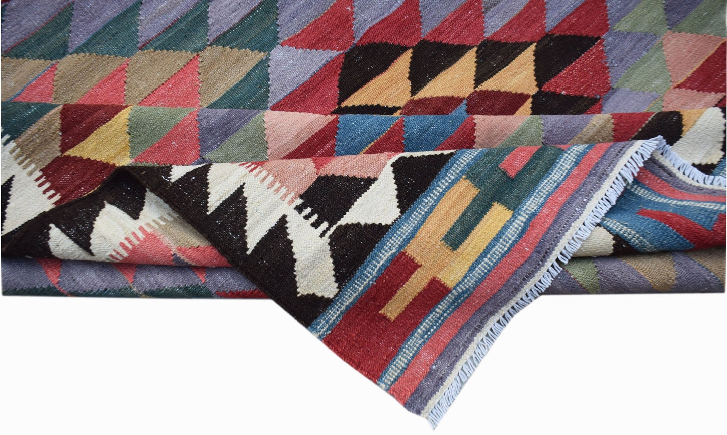 Handwoven Afghan Maimana kilim featuring a colorful geometric pattern and flatweave wool texture.