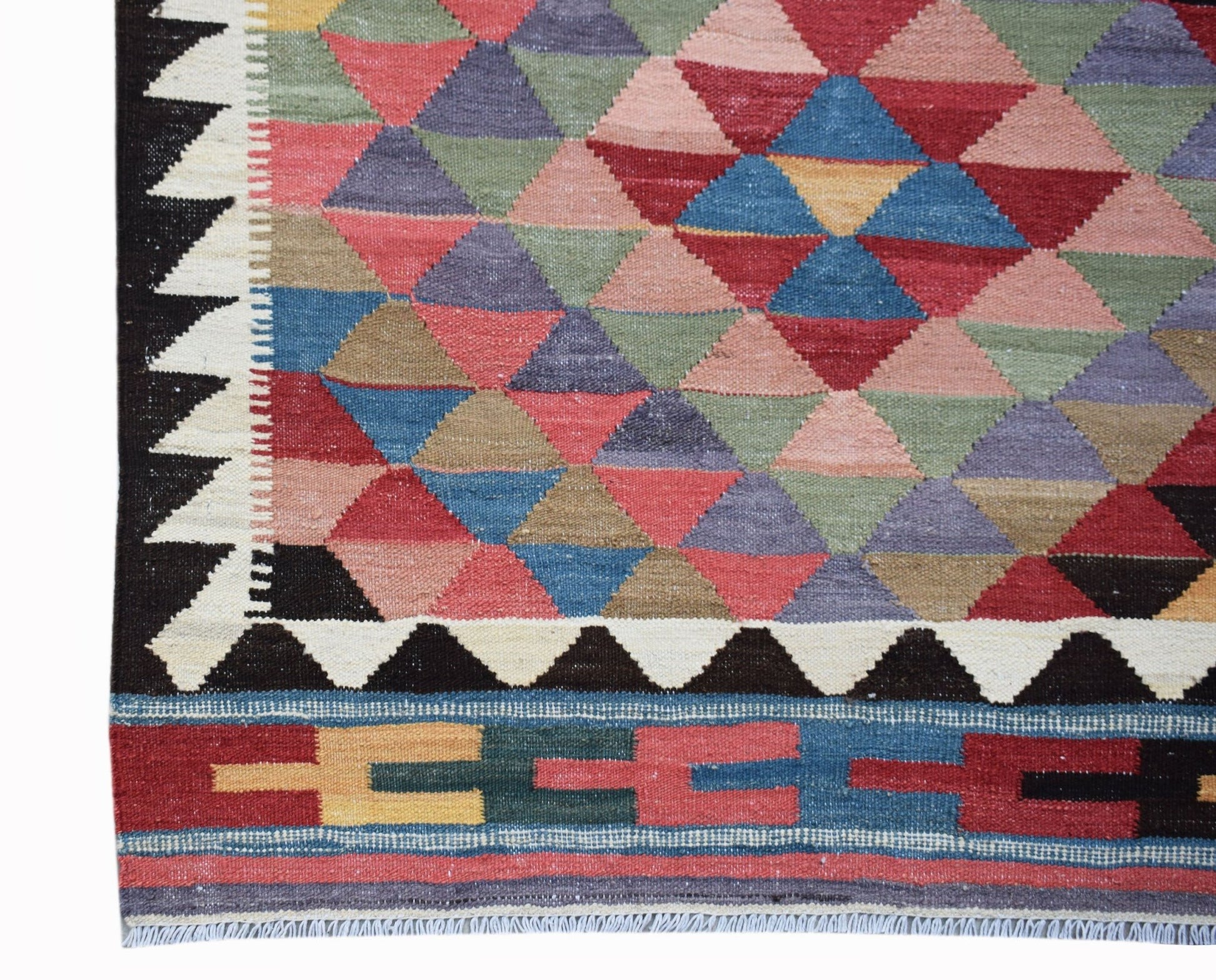 Handwoven Afghan Maimana kilim featuring a colorful geometric triangle pattern and fringed edges.