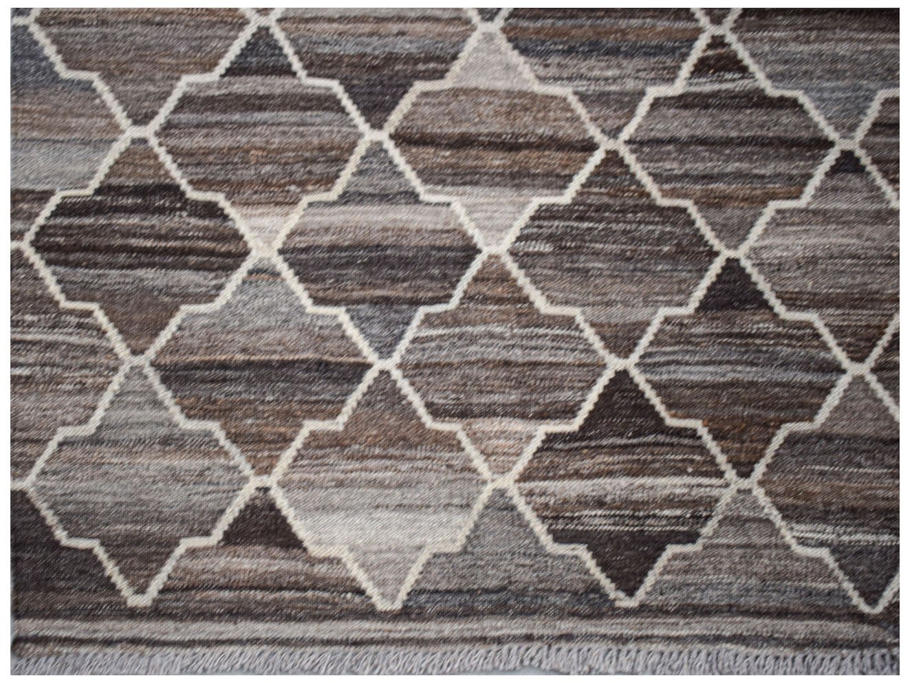 Handwoven Afghan Maimana kilim rug featuring a brown and grey geometric quatrefoil pattern.