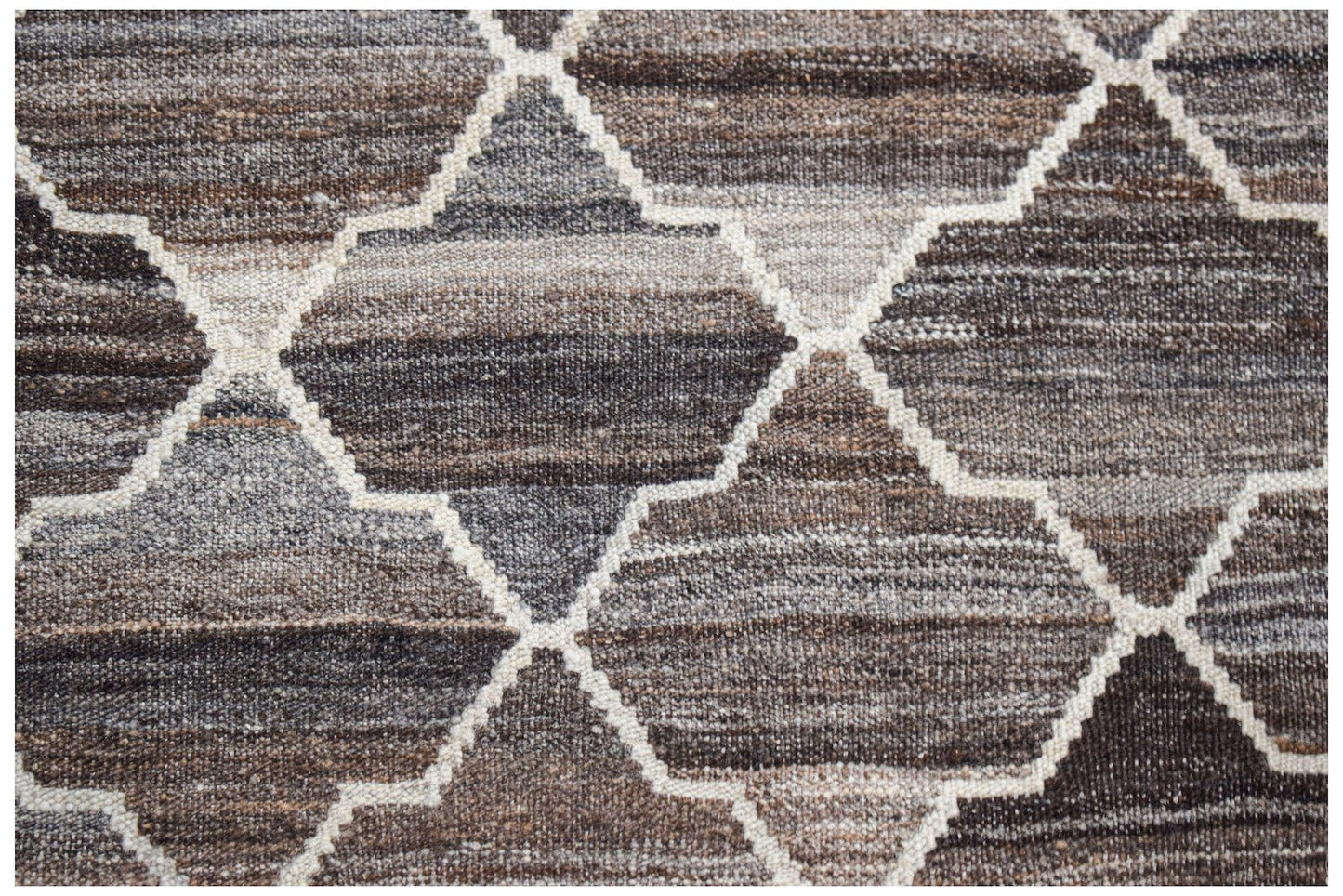 Handwoven Afghan Maimana kilim featuring a geometric trellis pattern in shades of brown and grey.