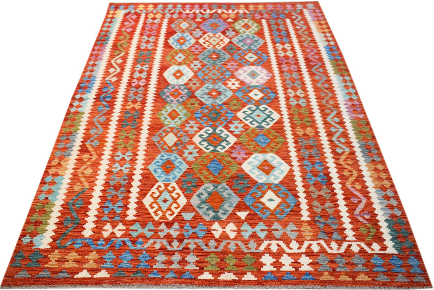 Handwoven Afghan Maimana kilim rug featuring a vibrant red field with geometric diamond patterns.