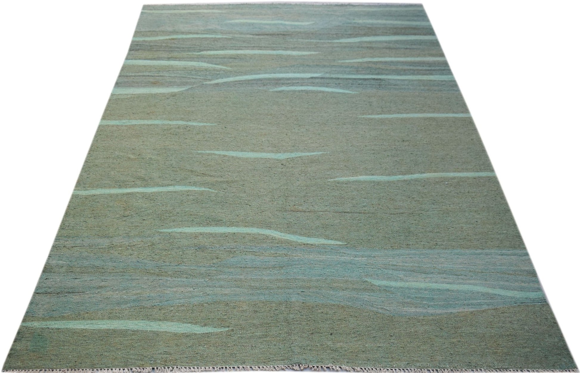 A handmade Afghan Maimana kilim rug featuring an abstract, wavy pattern in shades of green and blue.