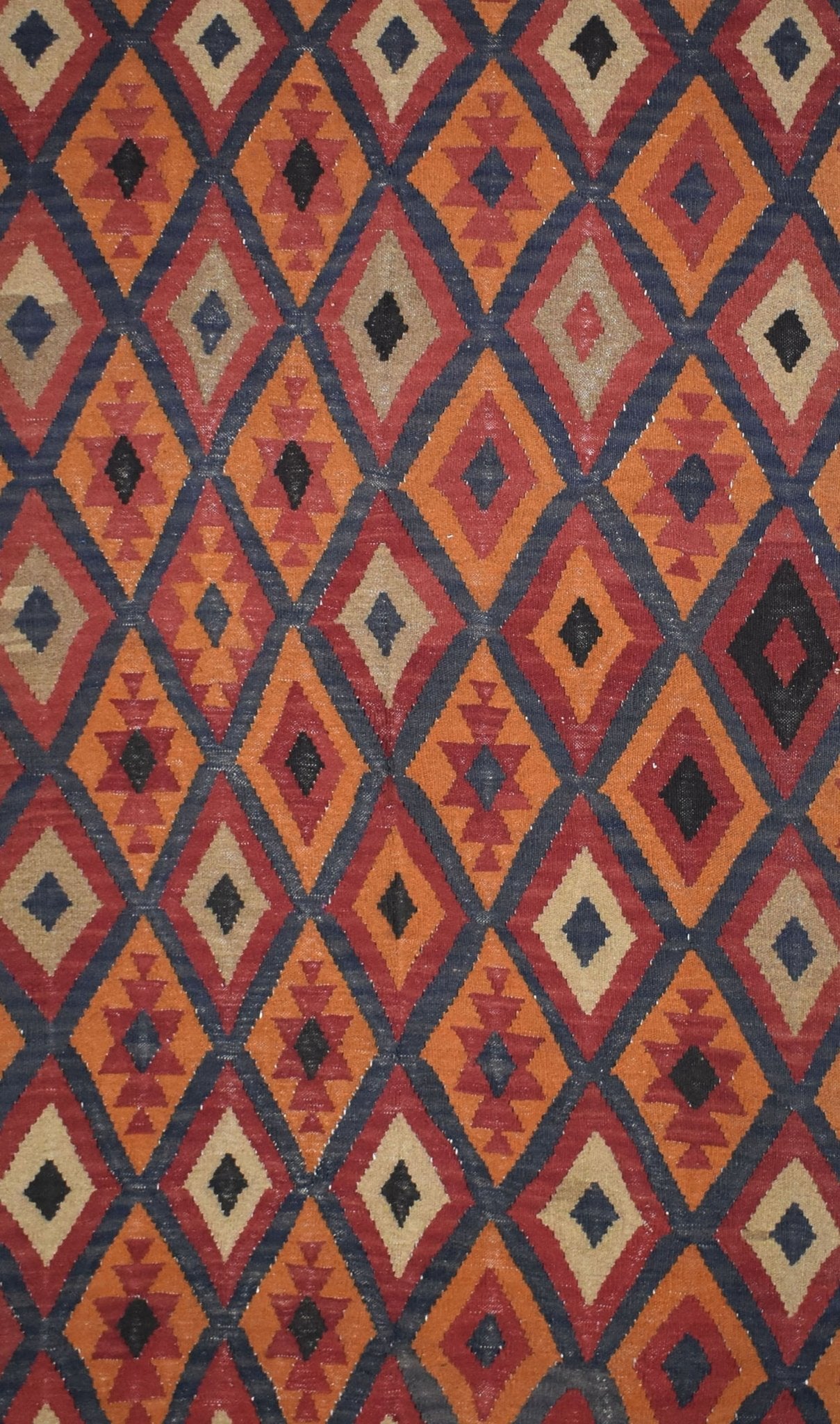 Handmade Afghan Maimana kilim rug featuring a repeating geometric diamond pattern in warm tones.