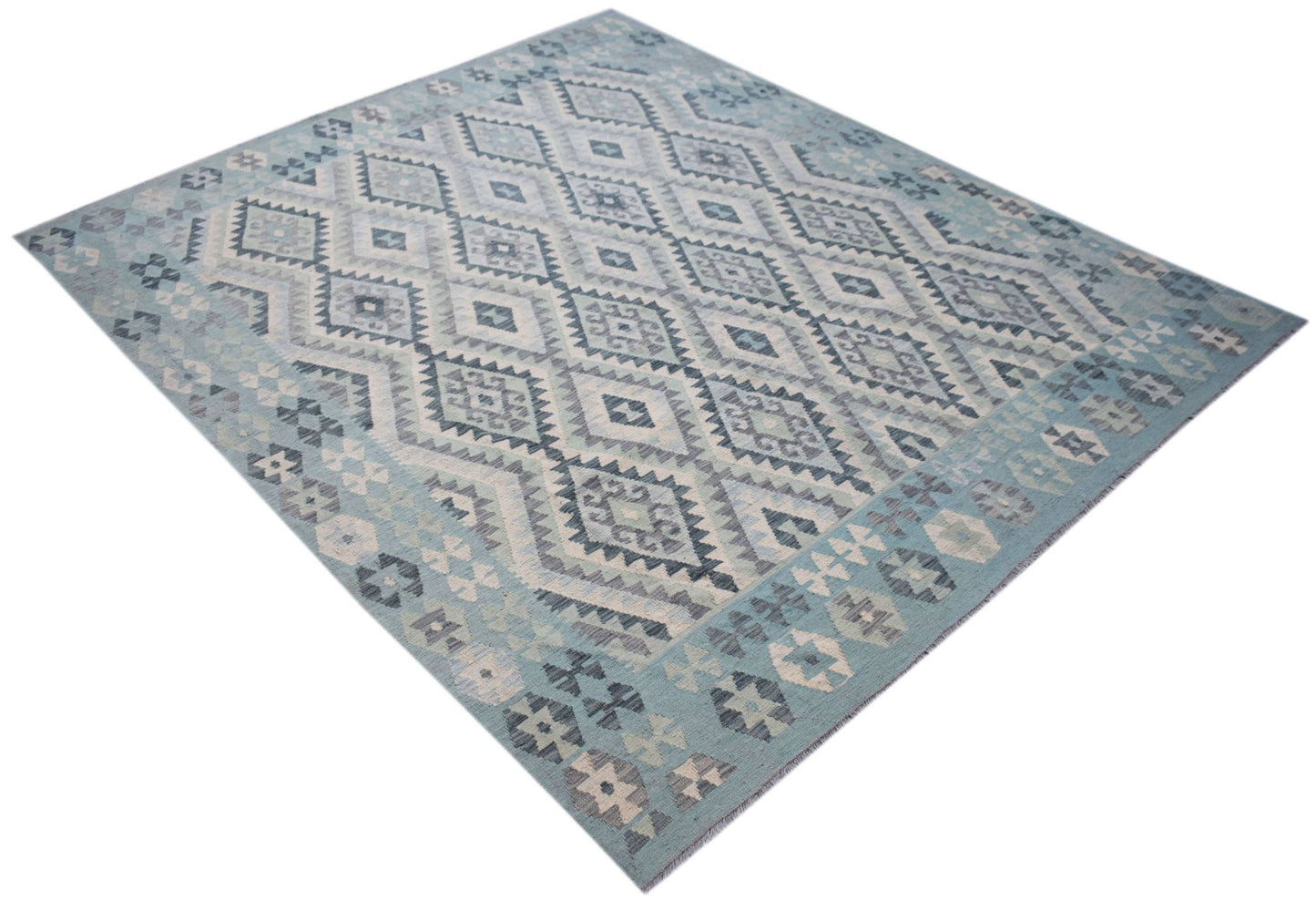 Handwoven Afghan Maimana kilim rug featuring a blue and grey geometric diamond pattern.